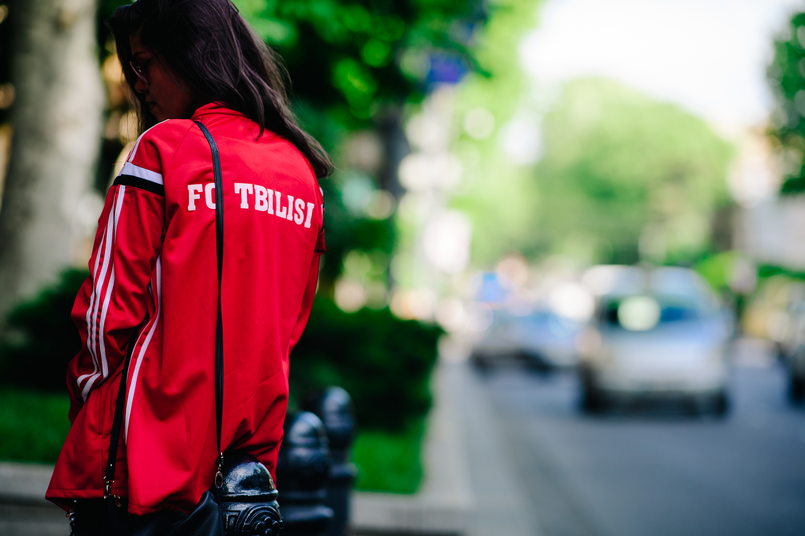 Woman wearing a red tracking jacket