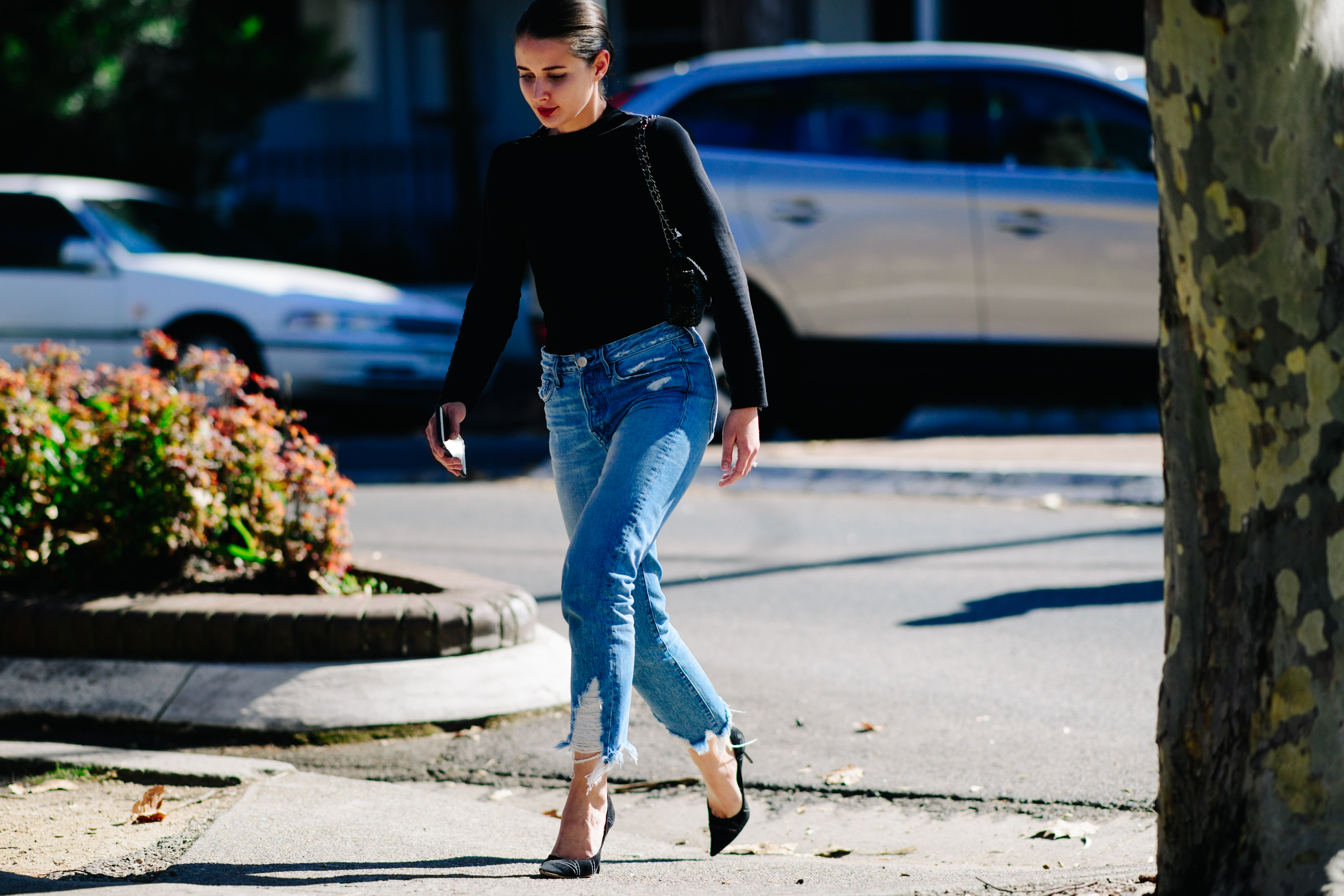 Woman wearing distressed jeans