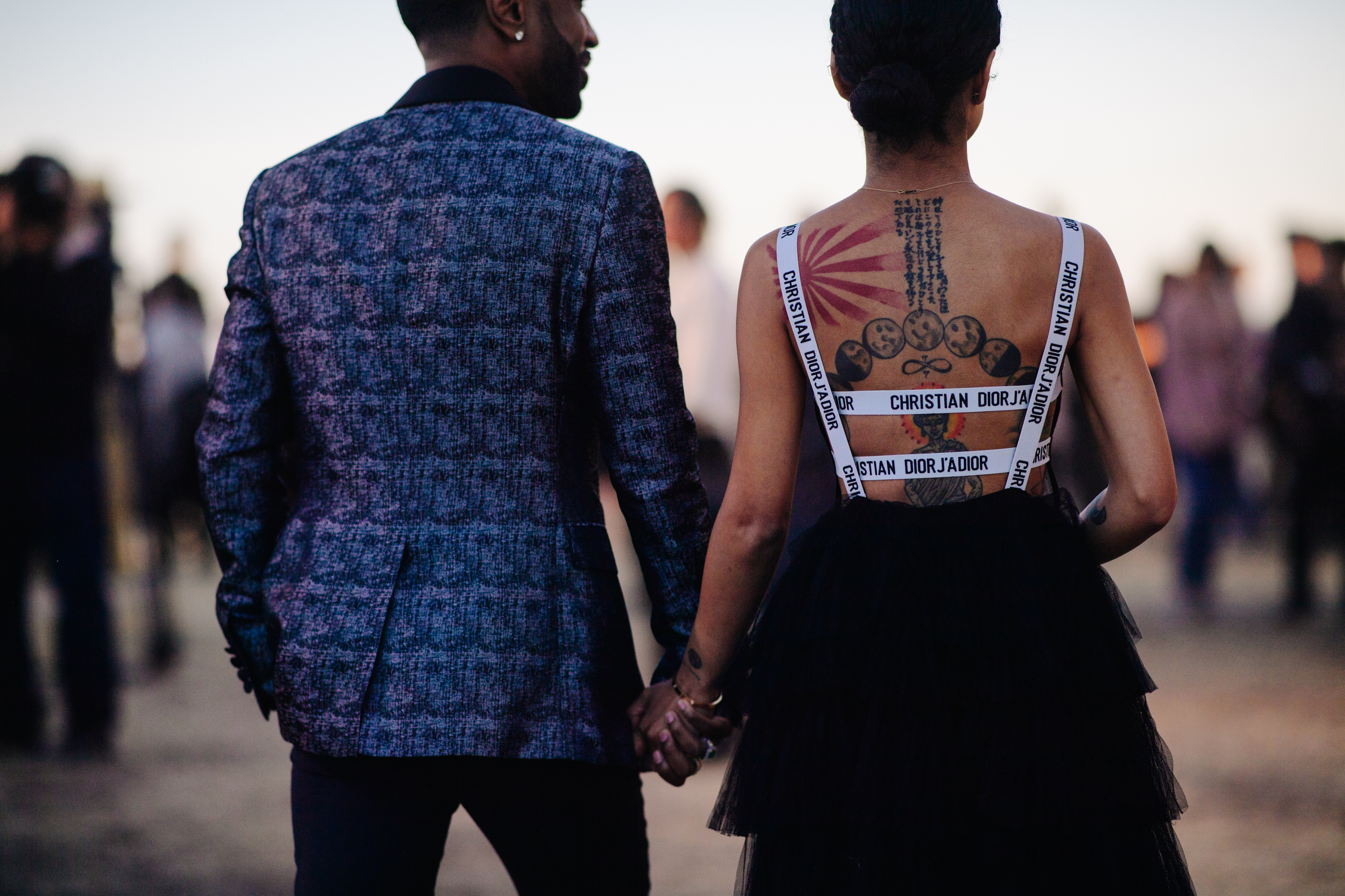 Music couple wearing Dior outfits