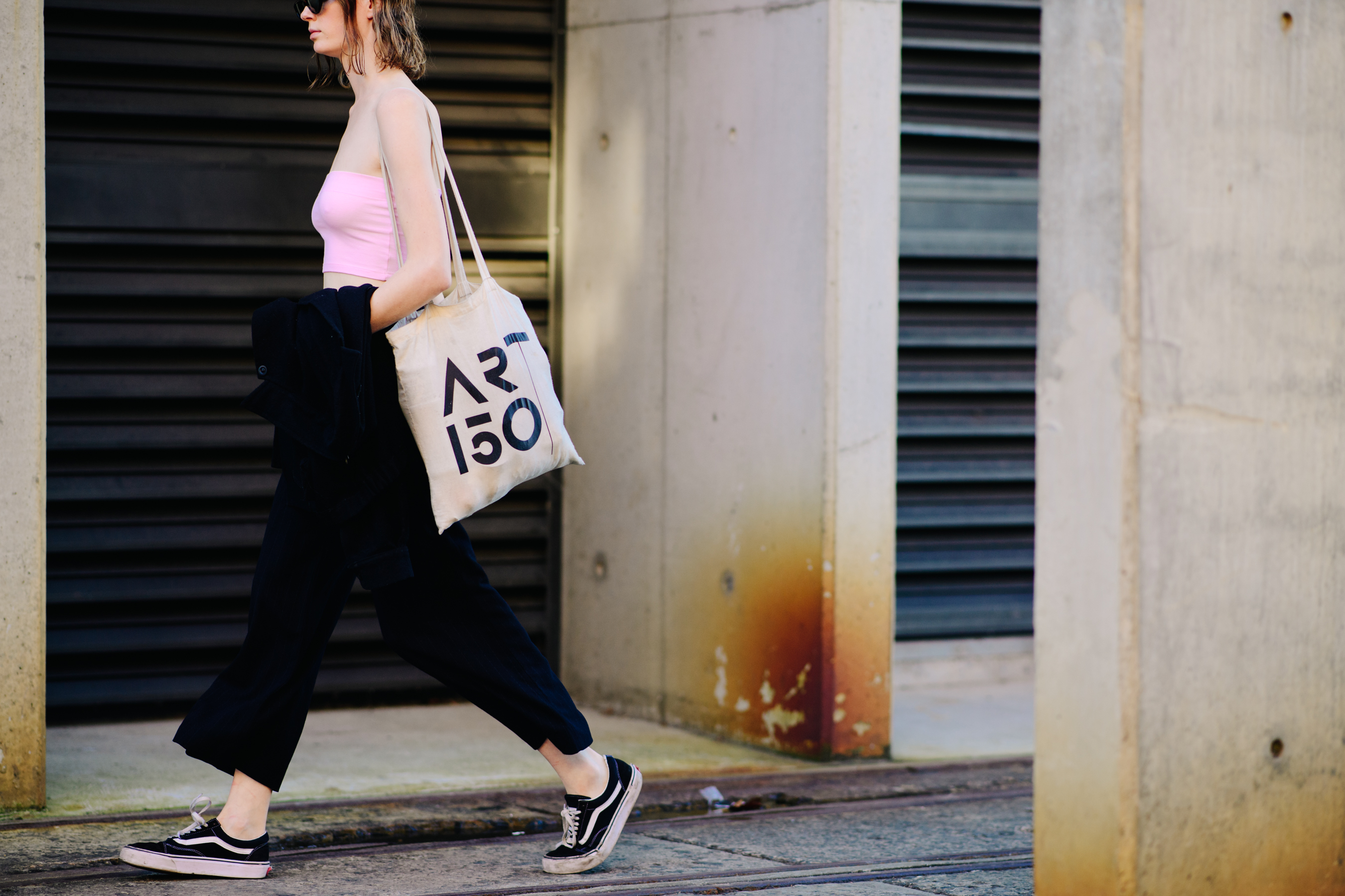 Girl carrying a beige tote bag
