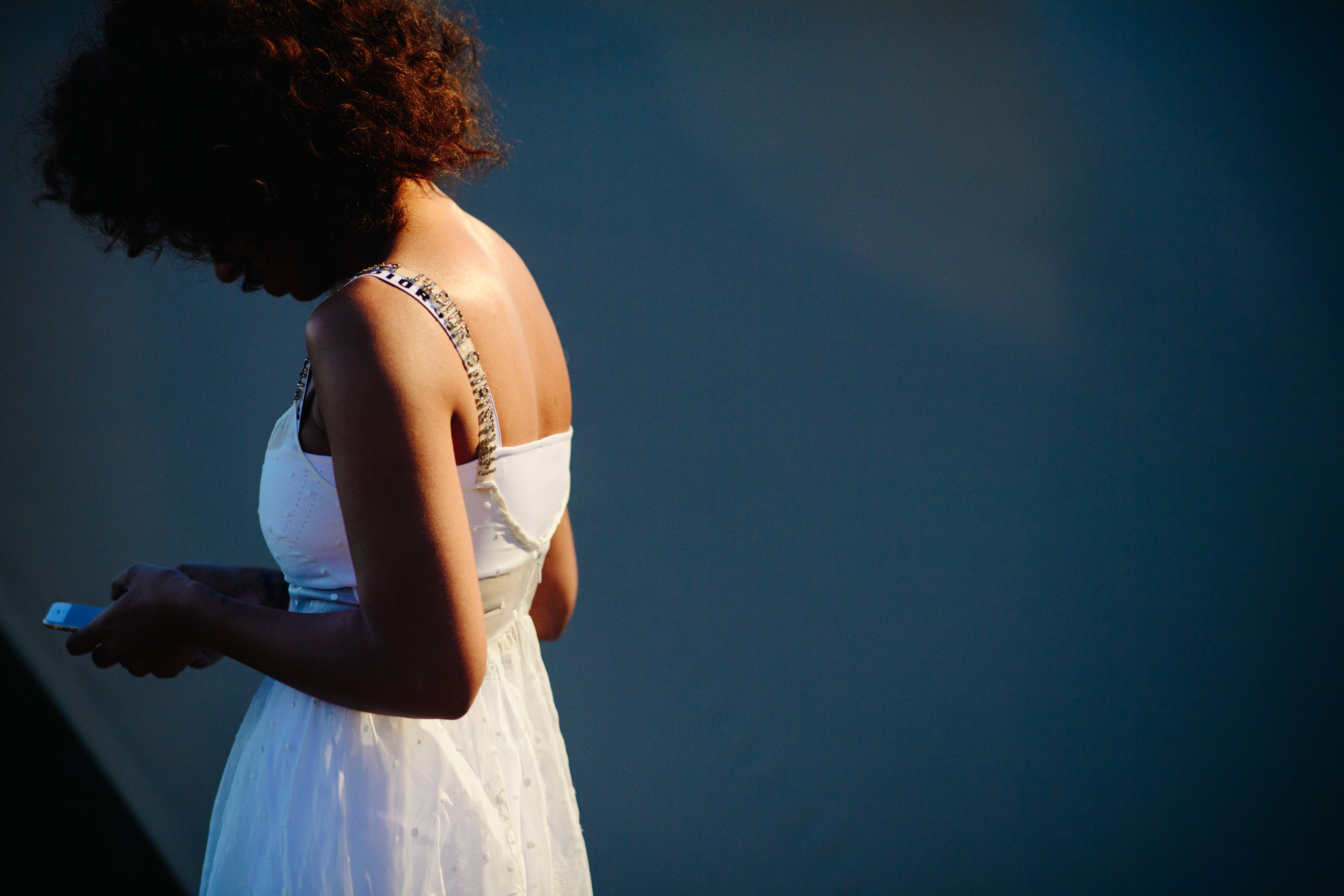 Singer wearing a white dress