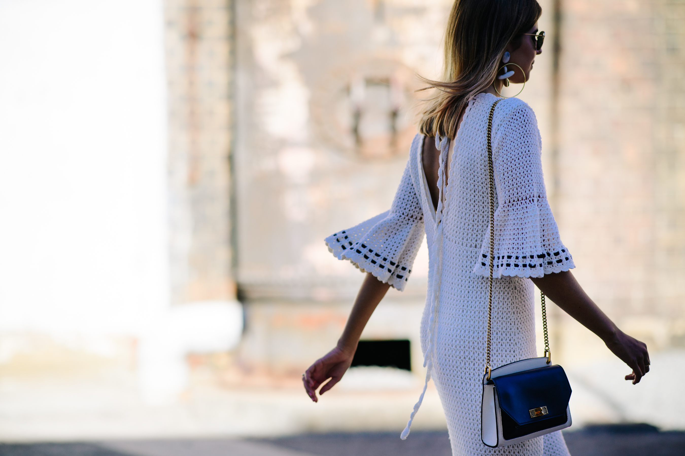 Woman wearing a knitted white dress
