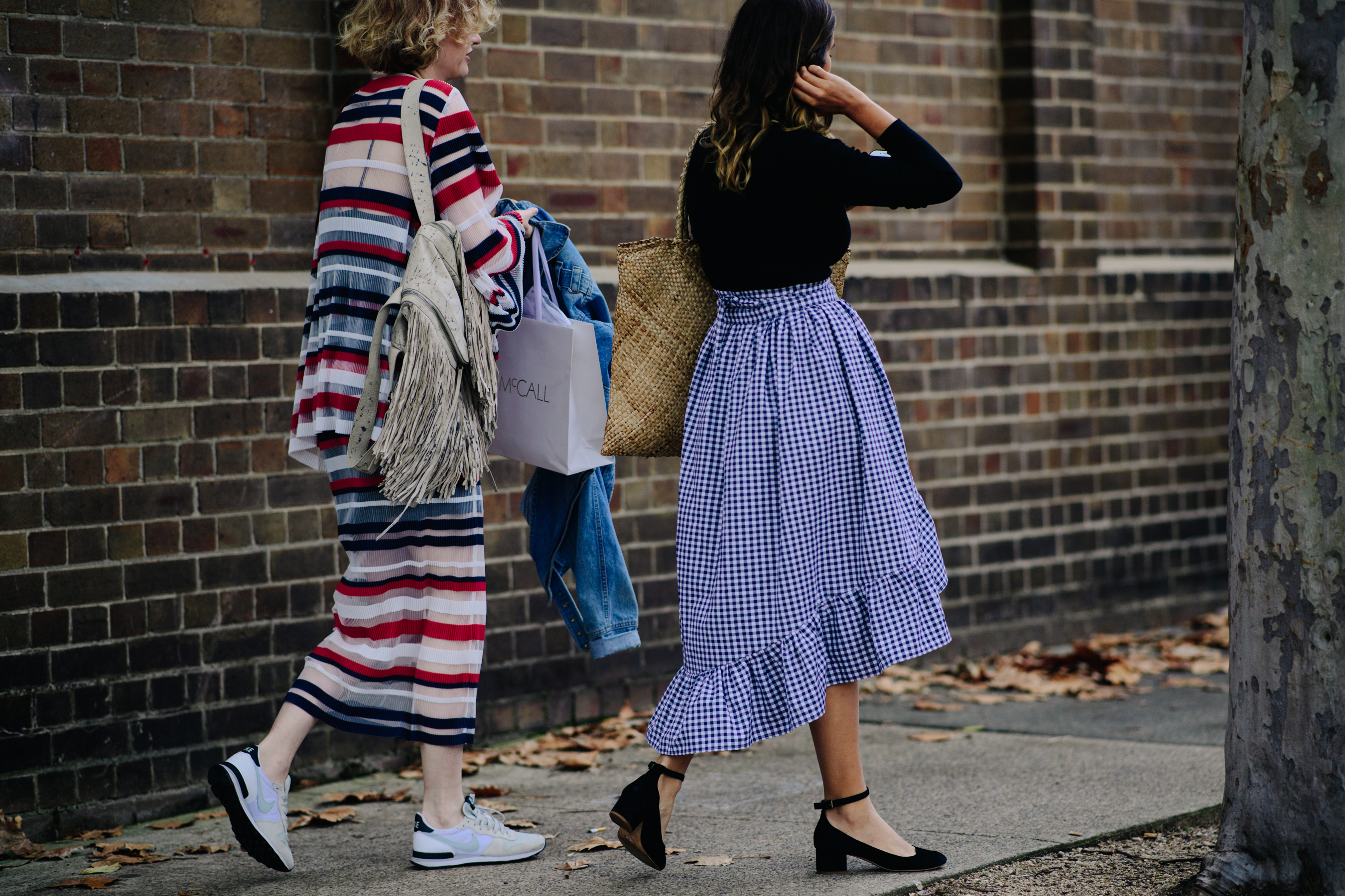 Two girls walking on the street