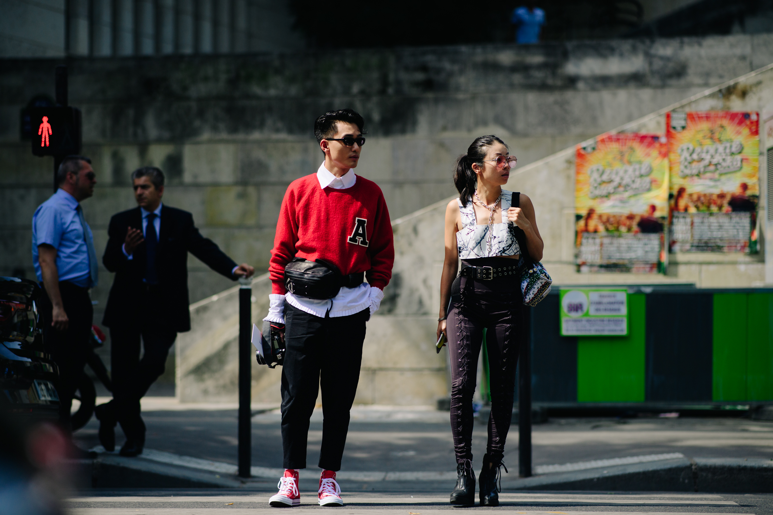 Asian photographer wearing red Converse