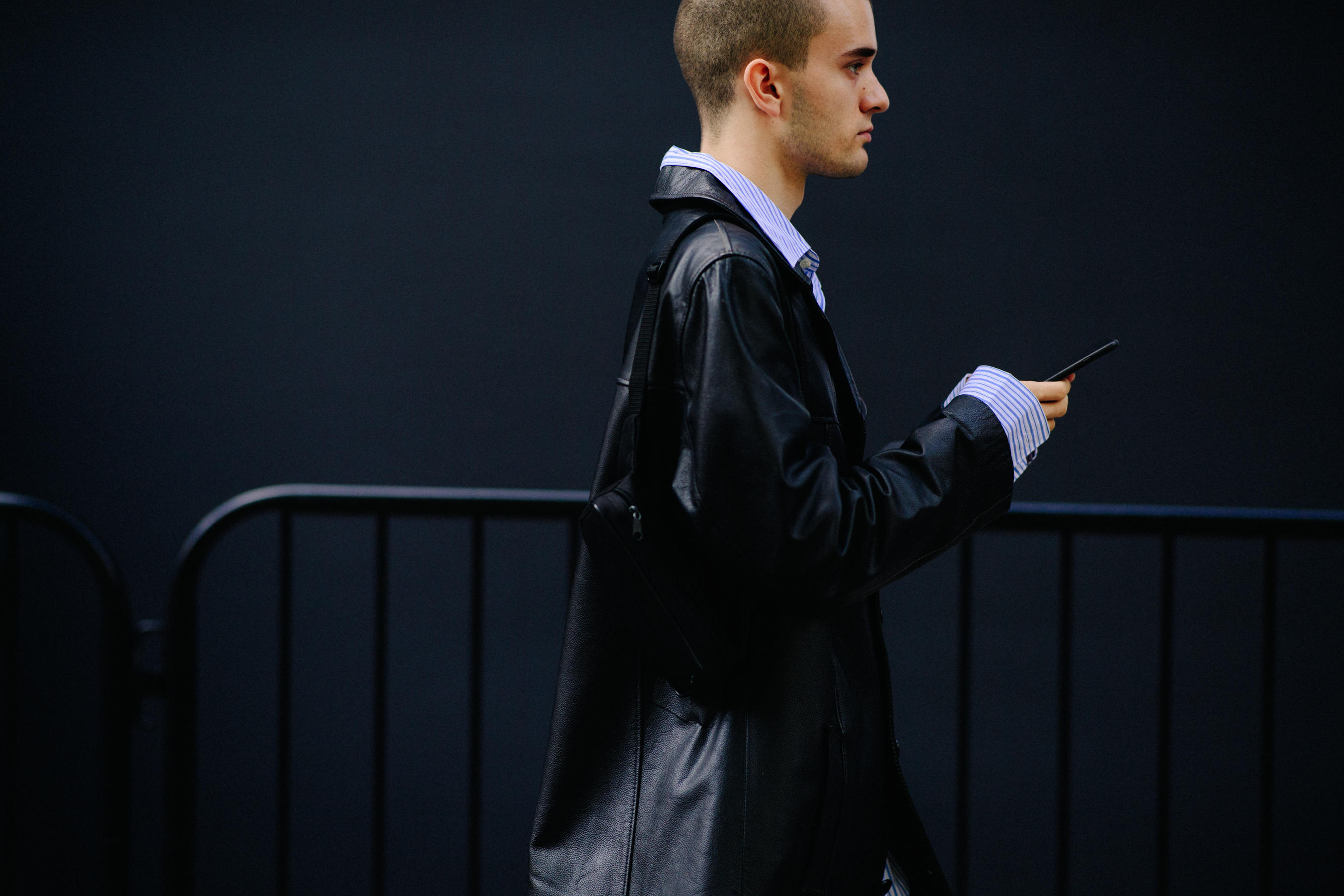 Boy wearing a black leather coat