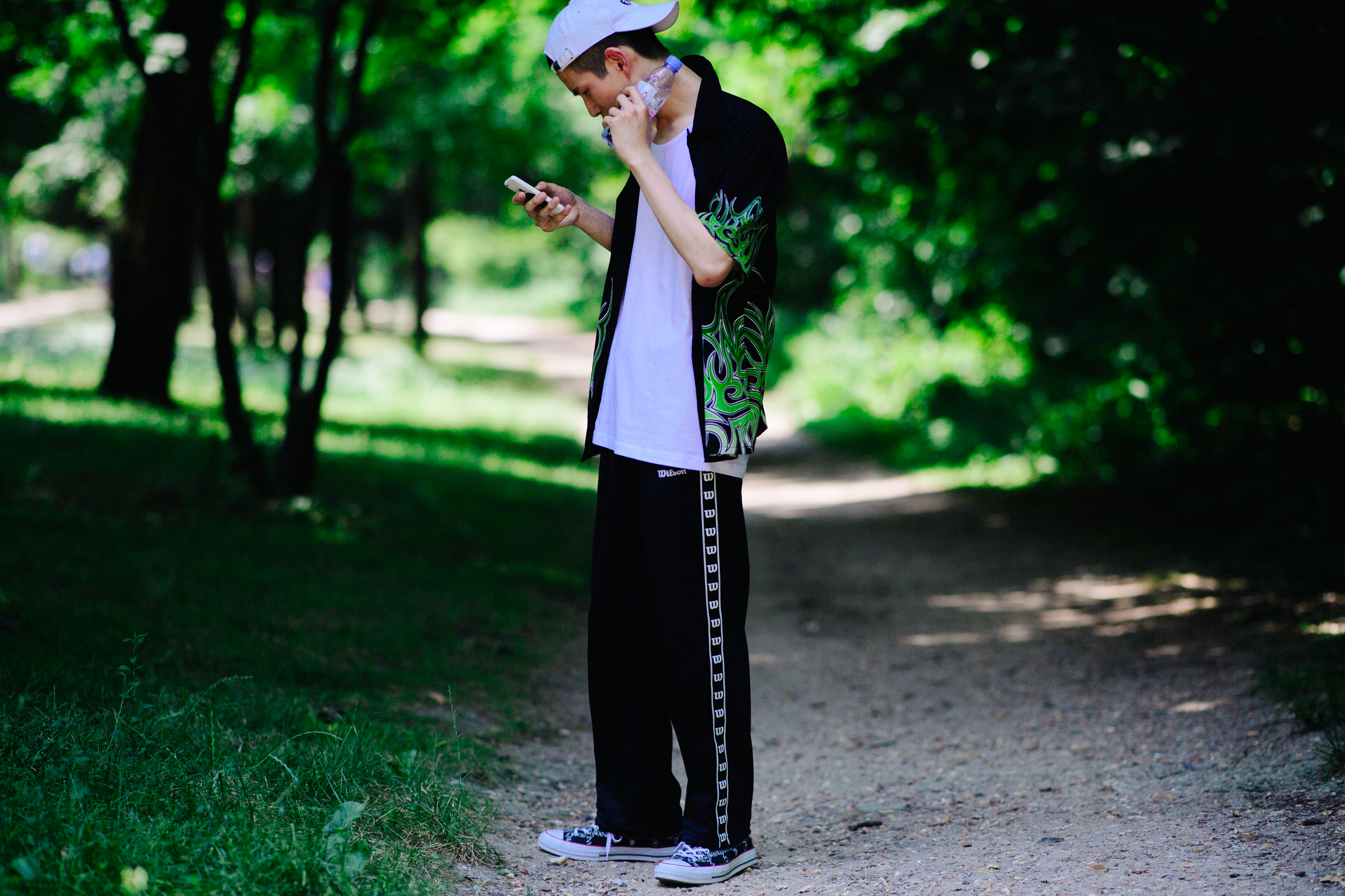 Man wearing Wilson and Converse
