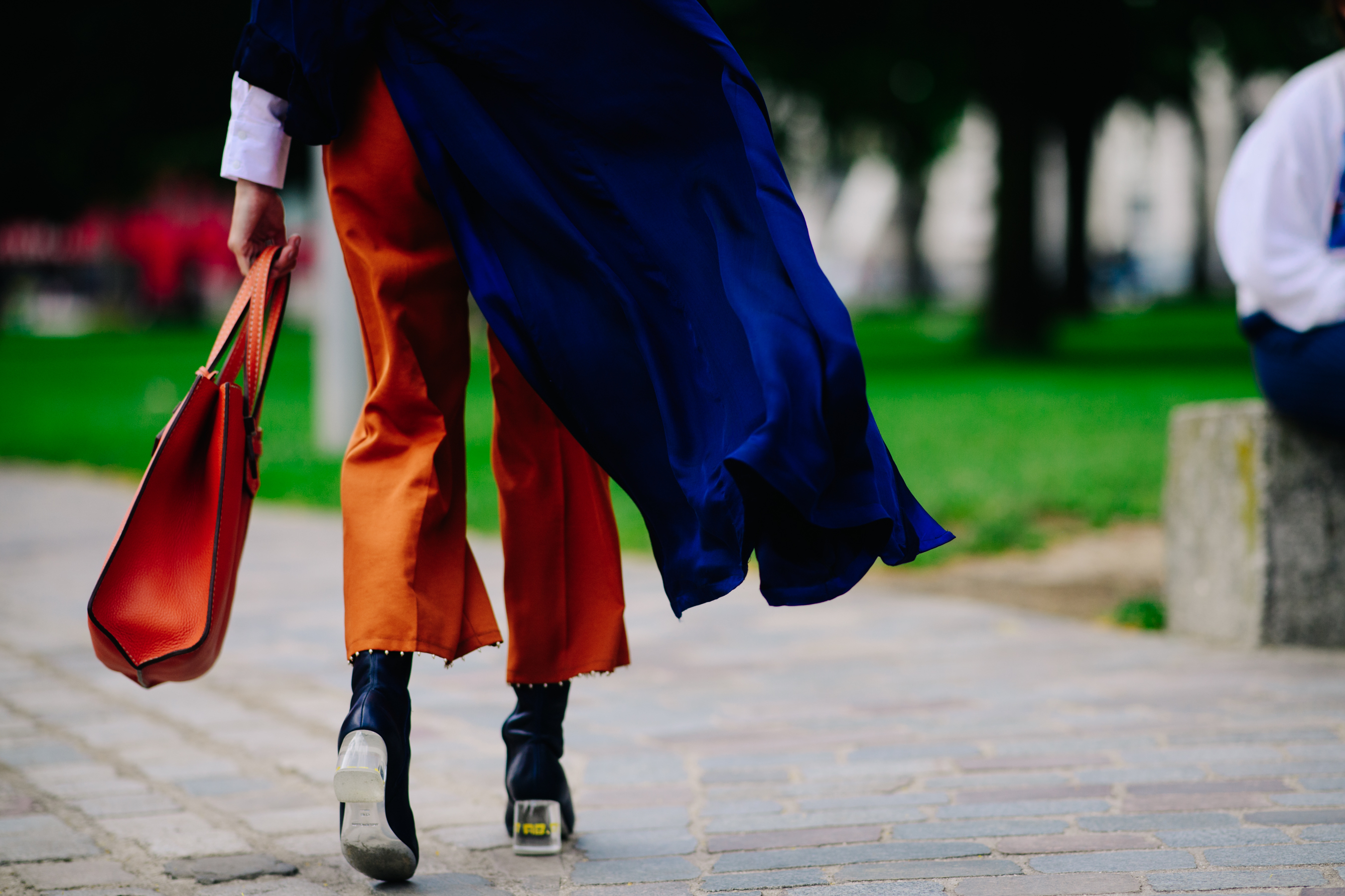 Woman wearing orange skinny trousers