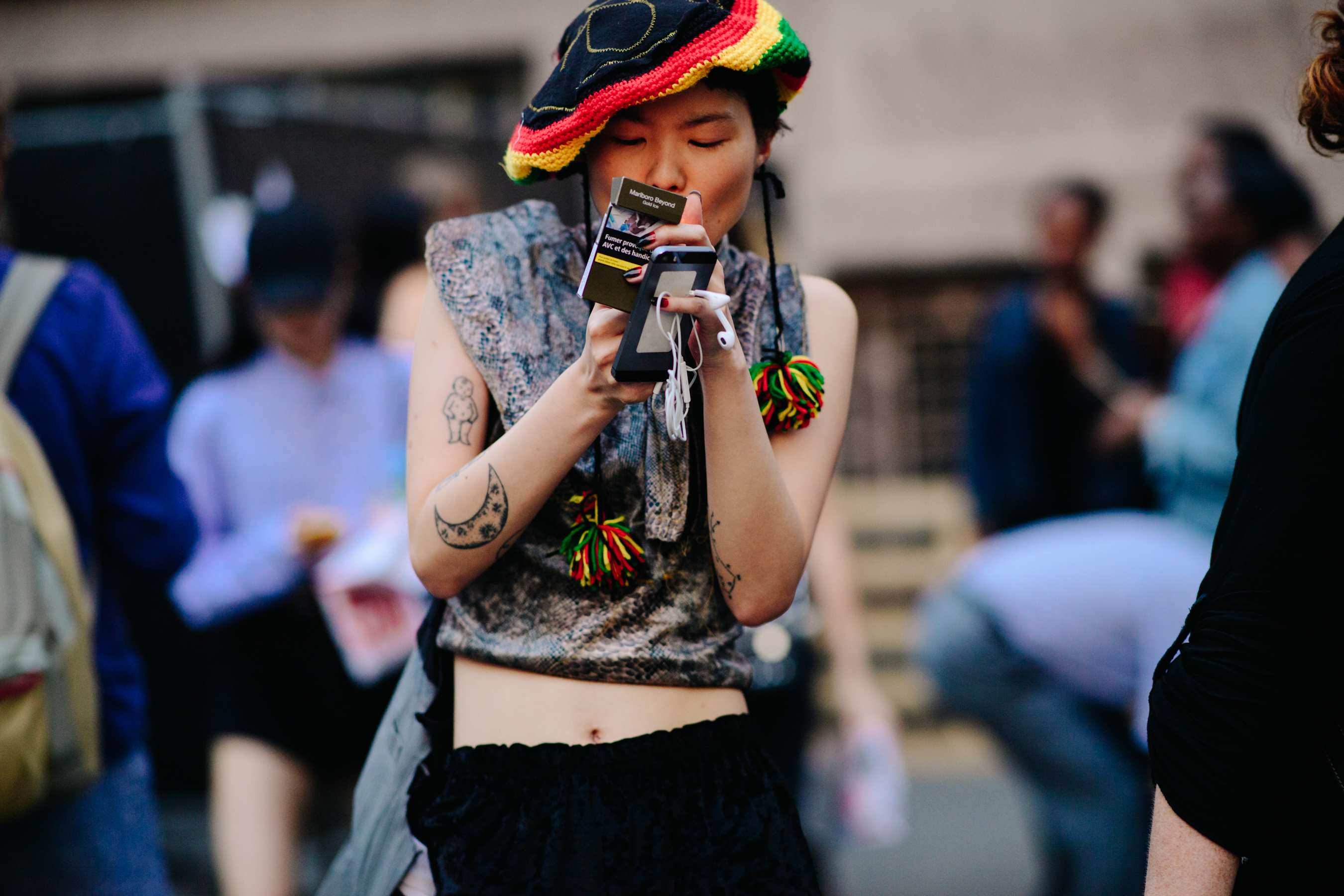 Asian girl wearing a Rasta hat