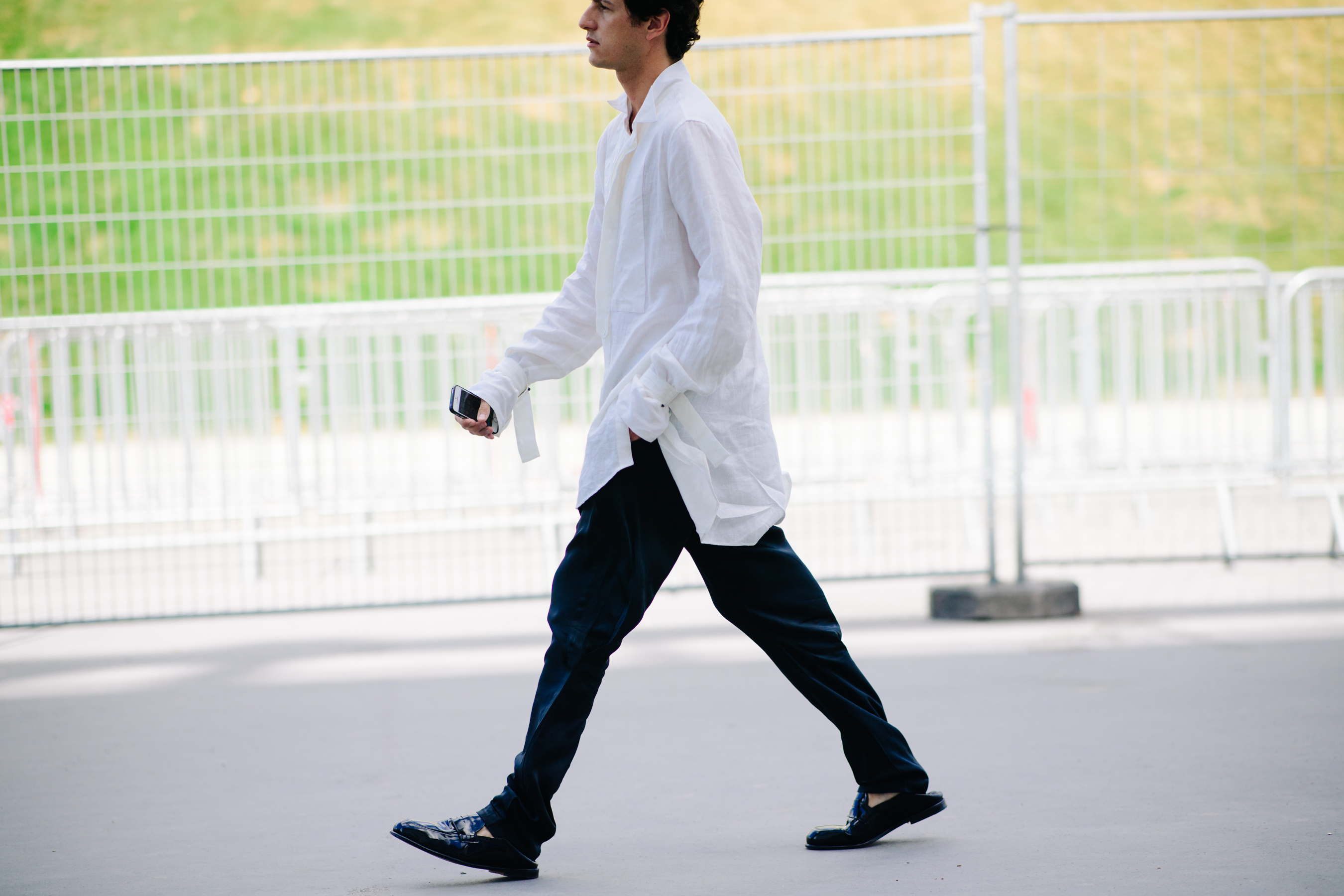 Man wearing a long white shirt