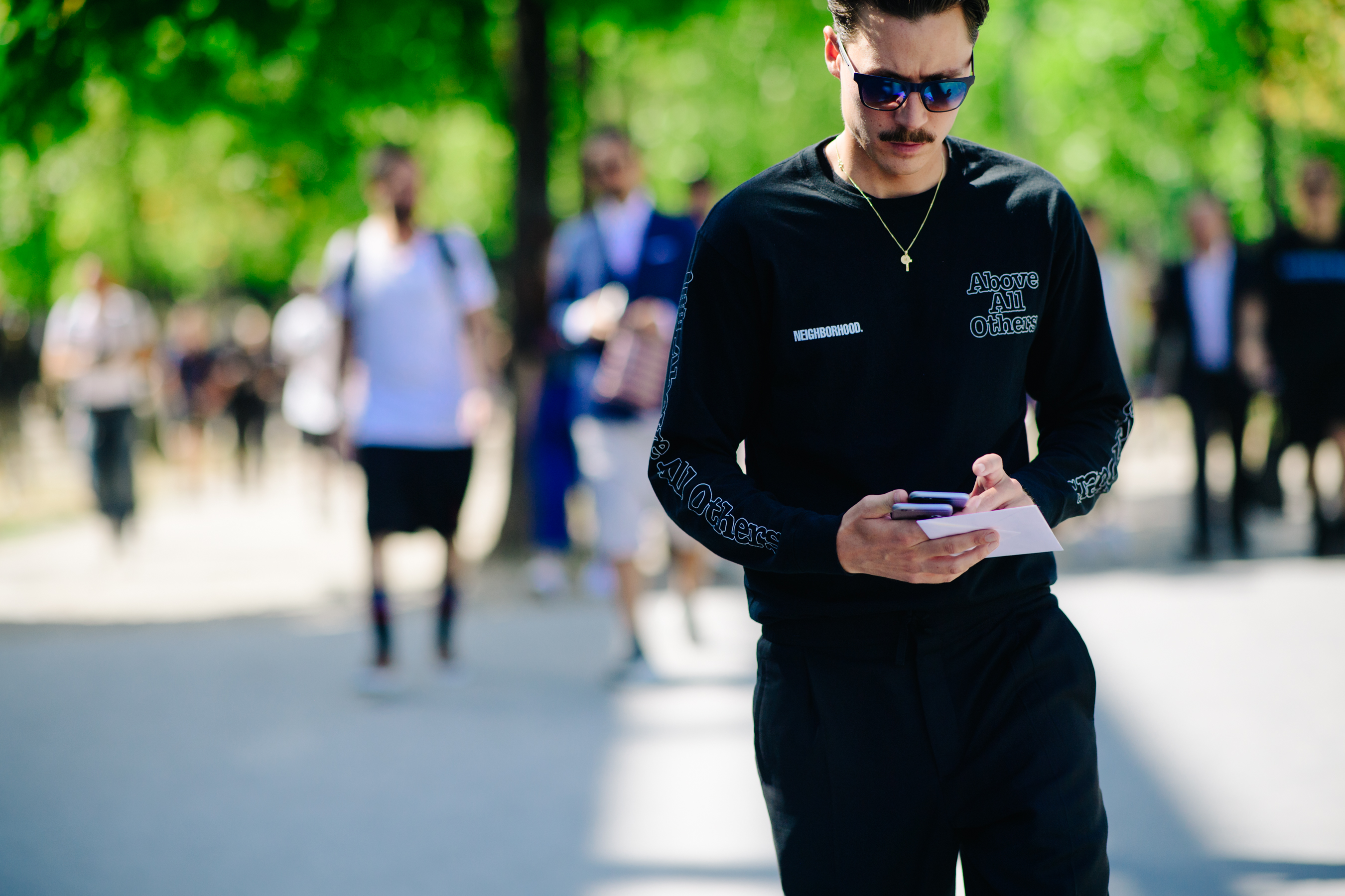 Man wearing a Neighborhood sweat