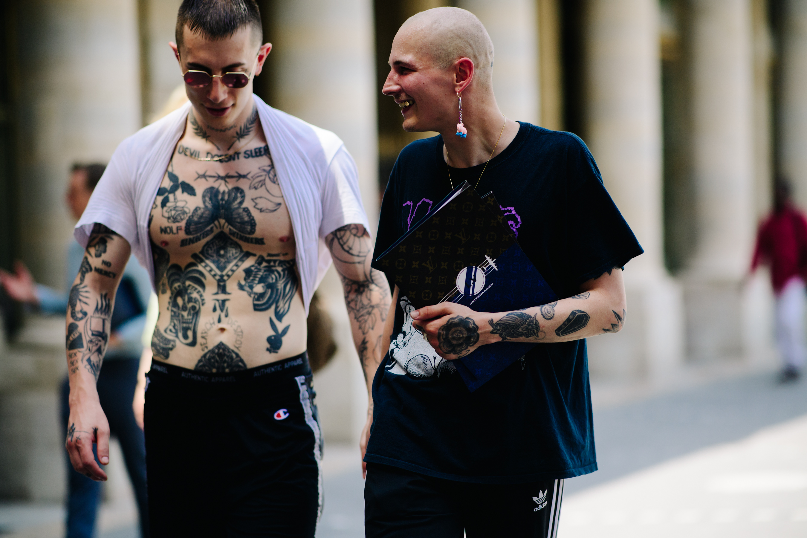 Tattooed man after Louis Vuitton show