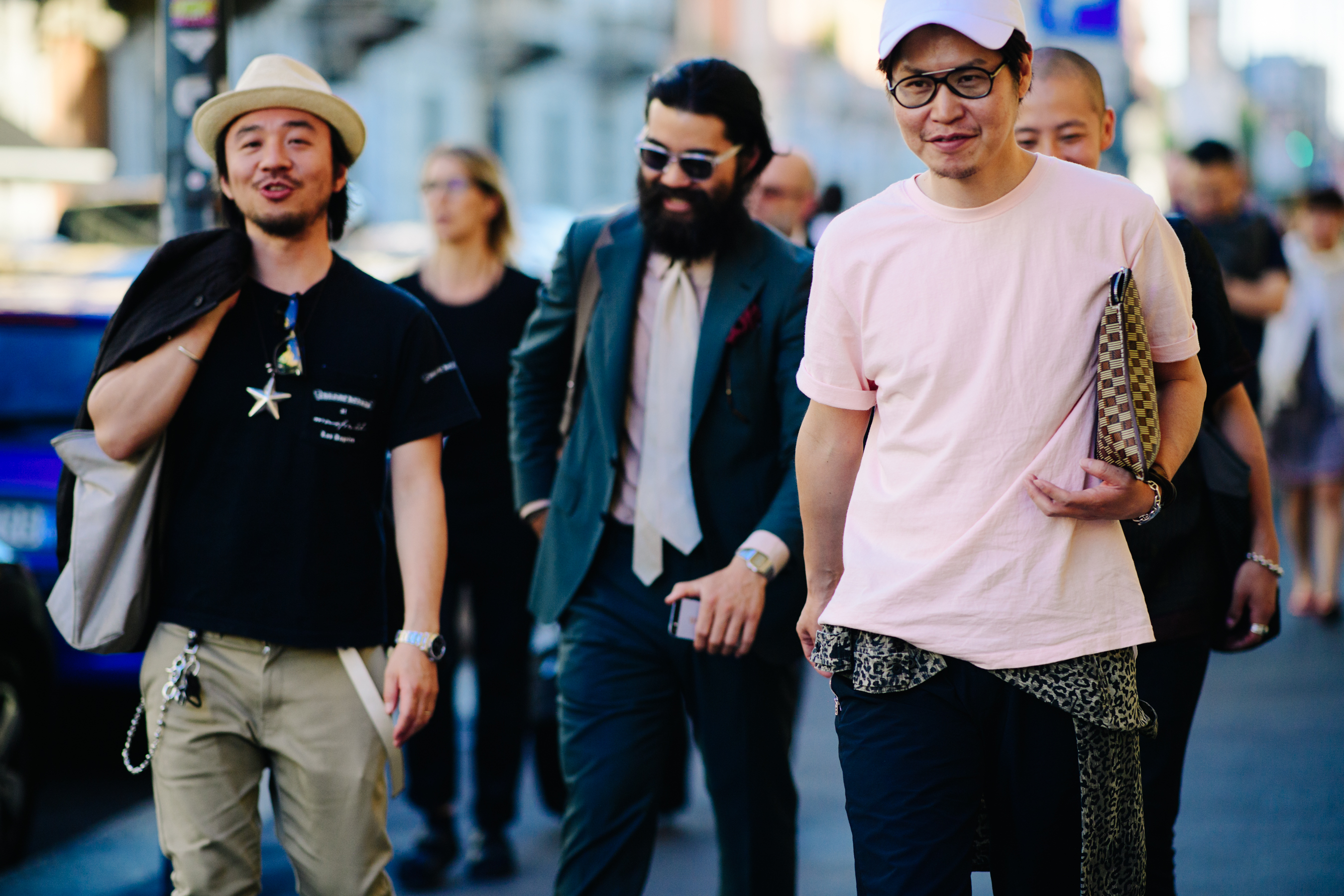 Man carrying a checkered cluthc