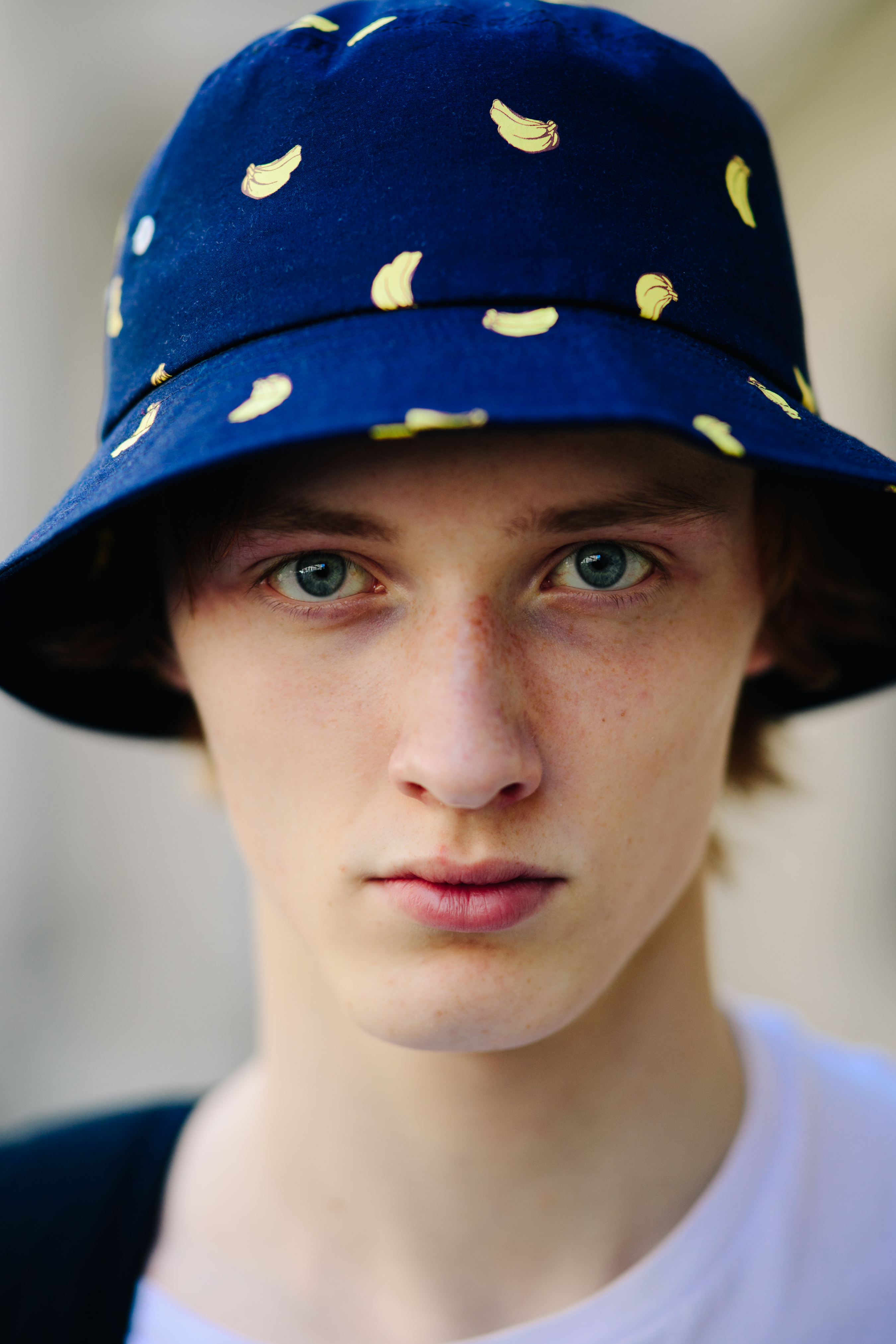 Model wearing a banana print panama