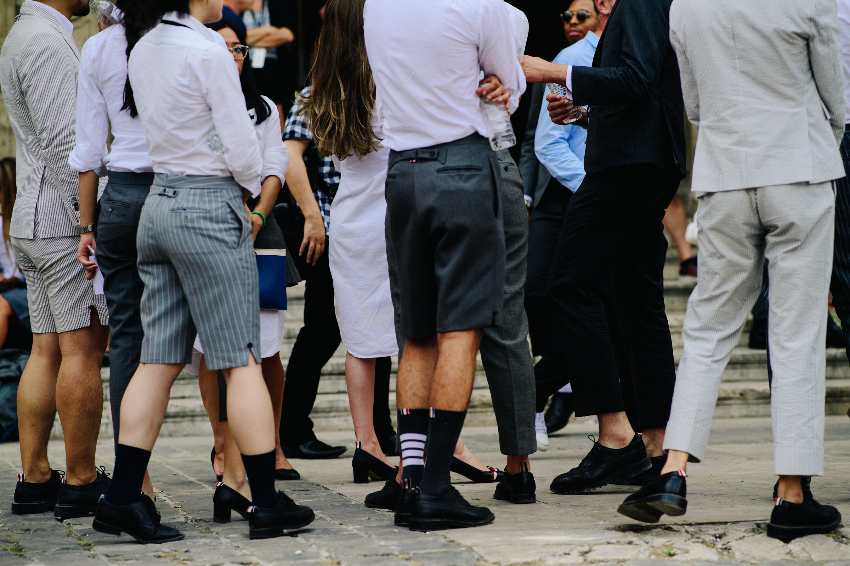 People wearing Thom Browne socks and shoes