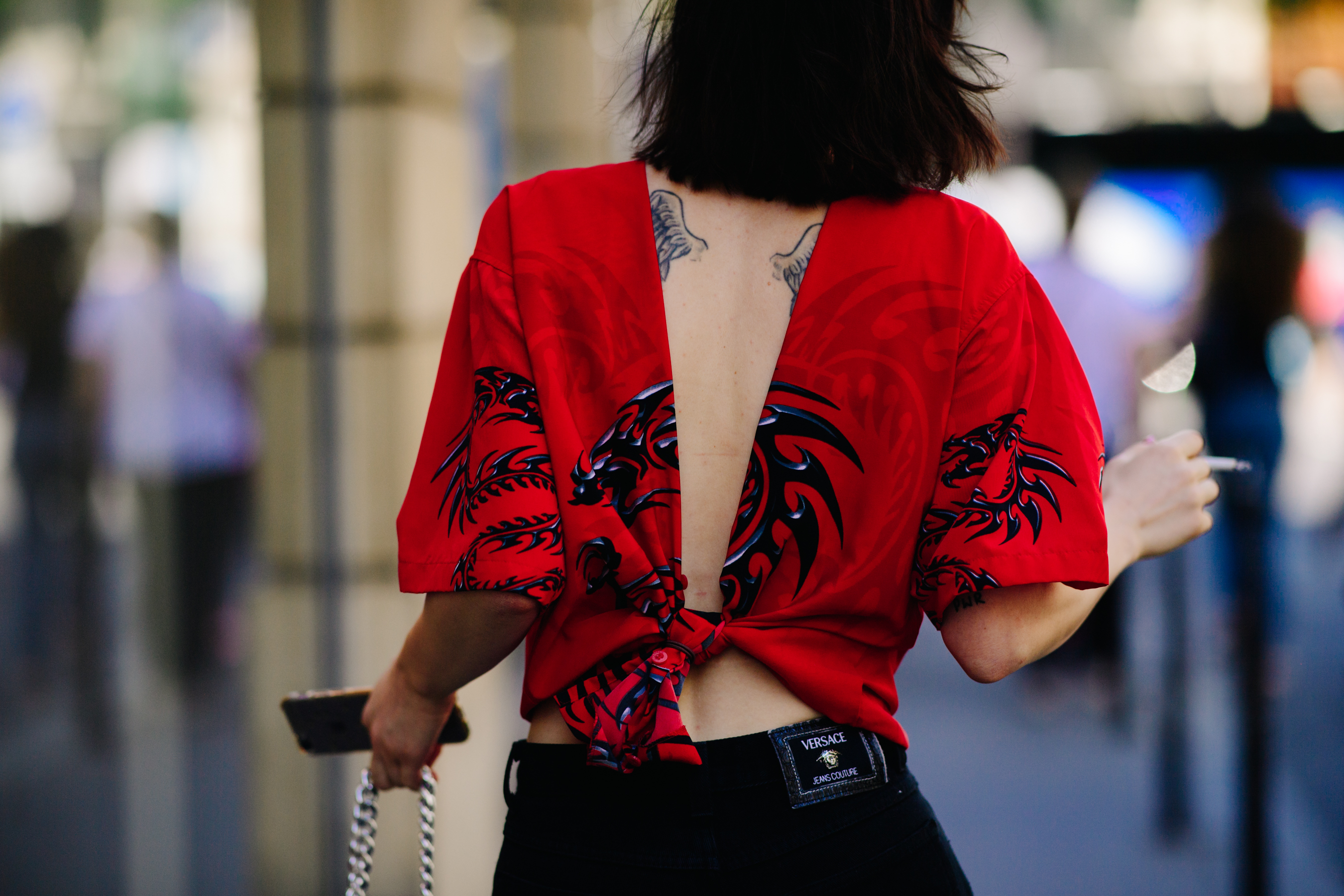 Woman wearing black Versace jeans