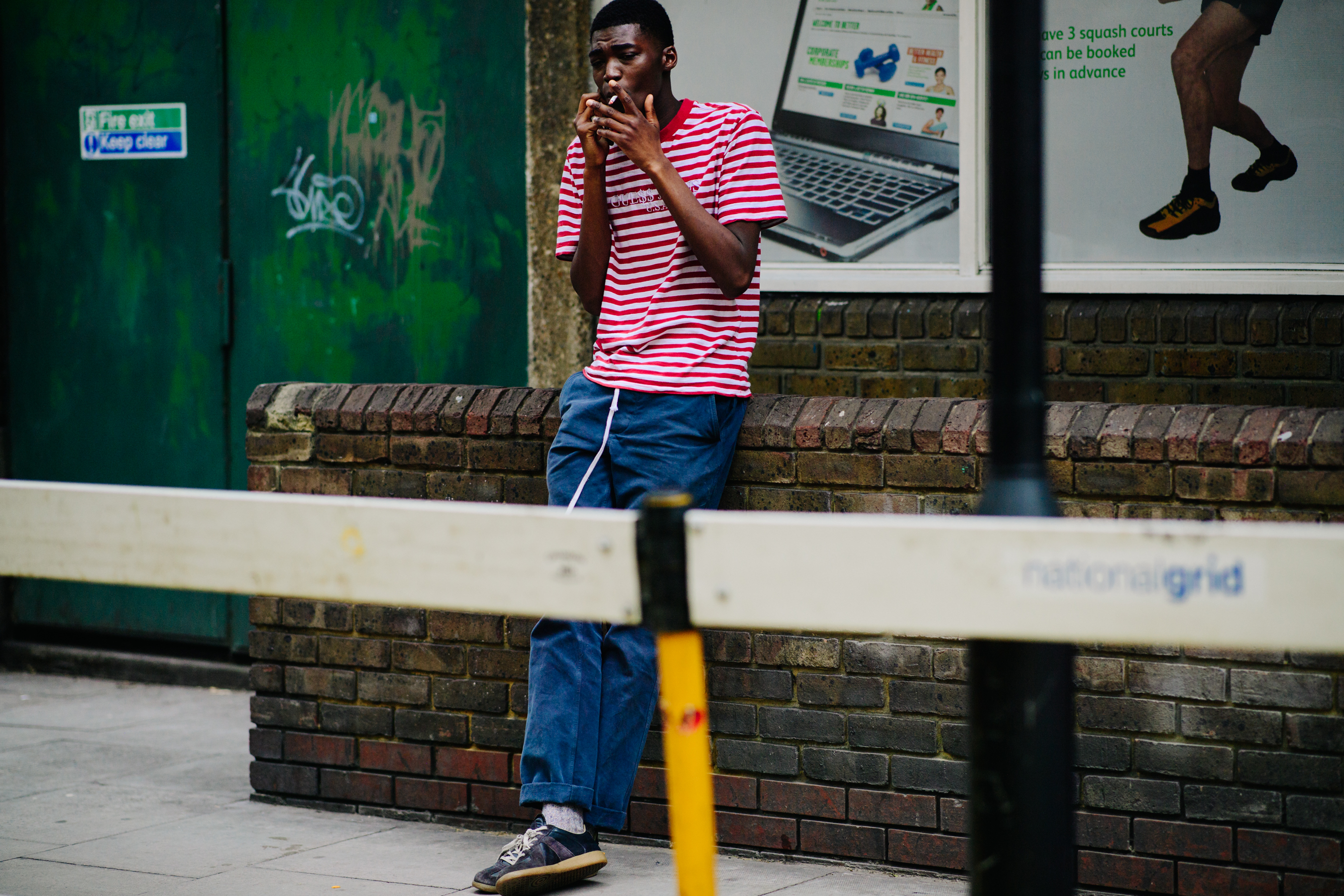 Model smoking outside Wales Bonner show