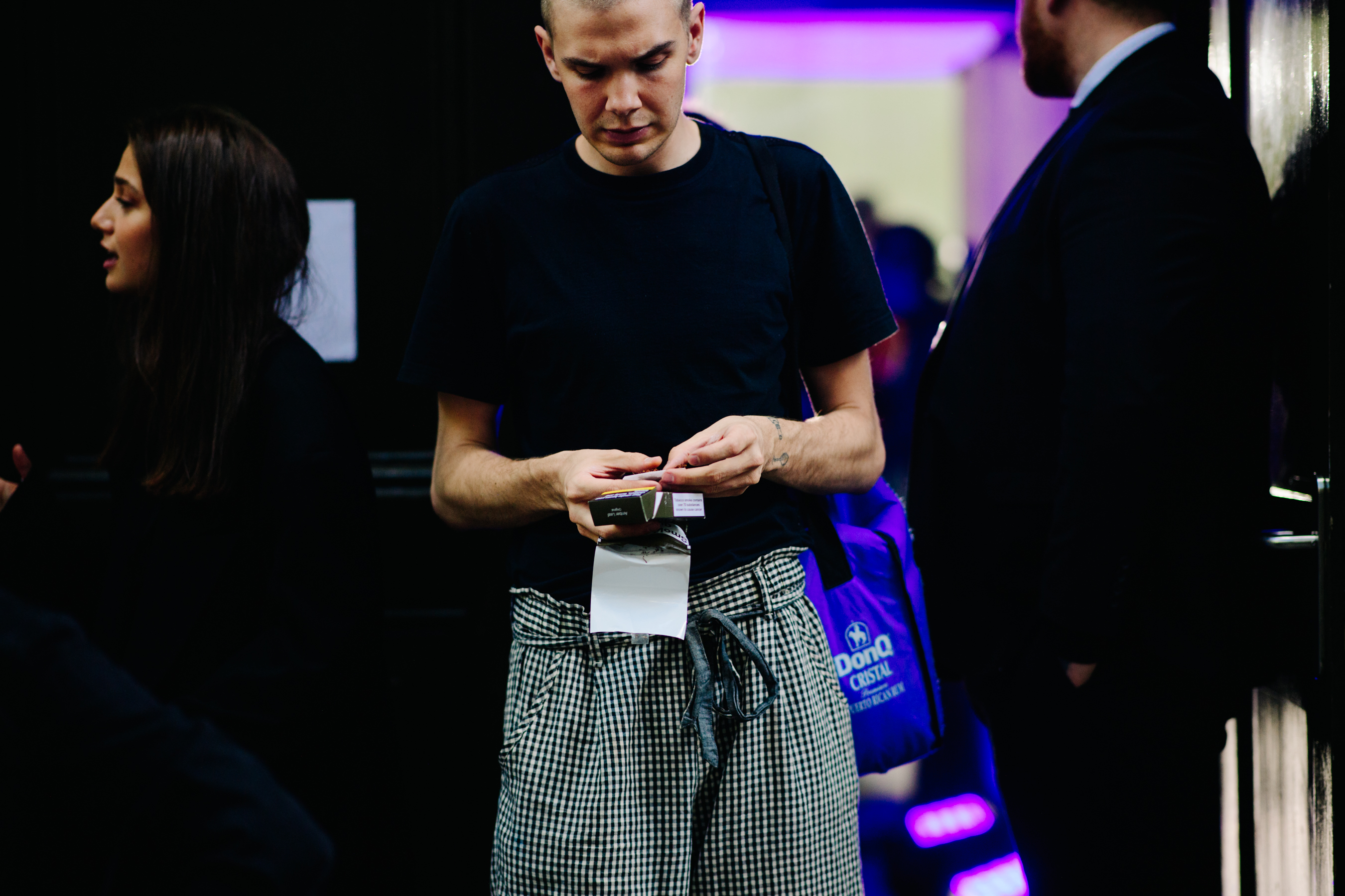 Guy wearing large checkered pants