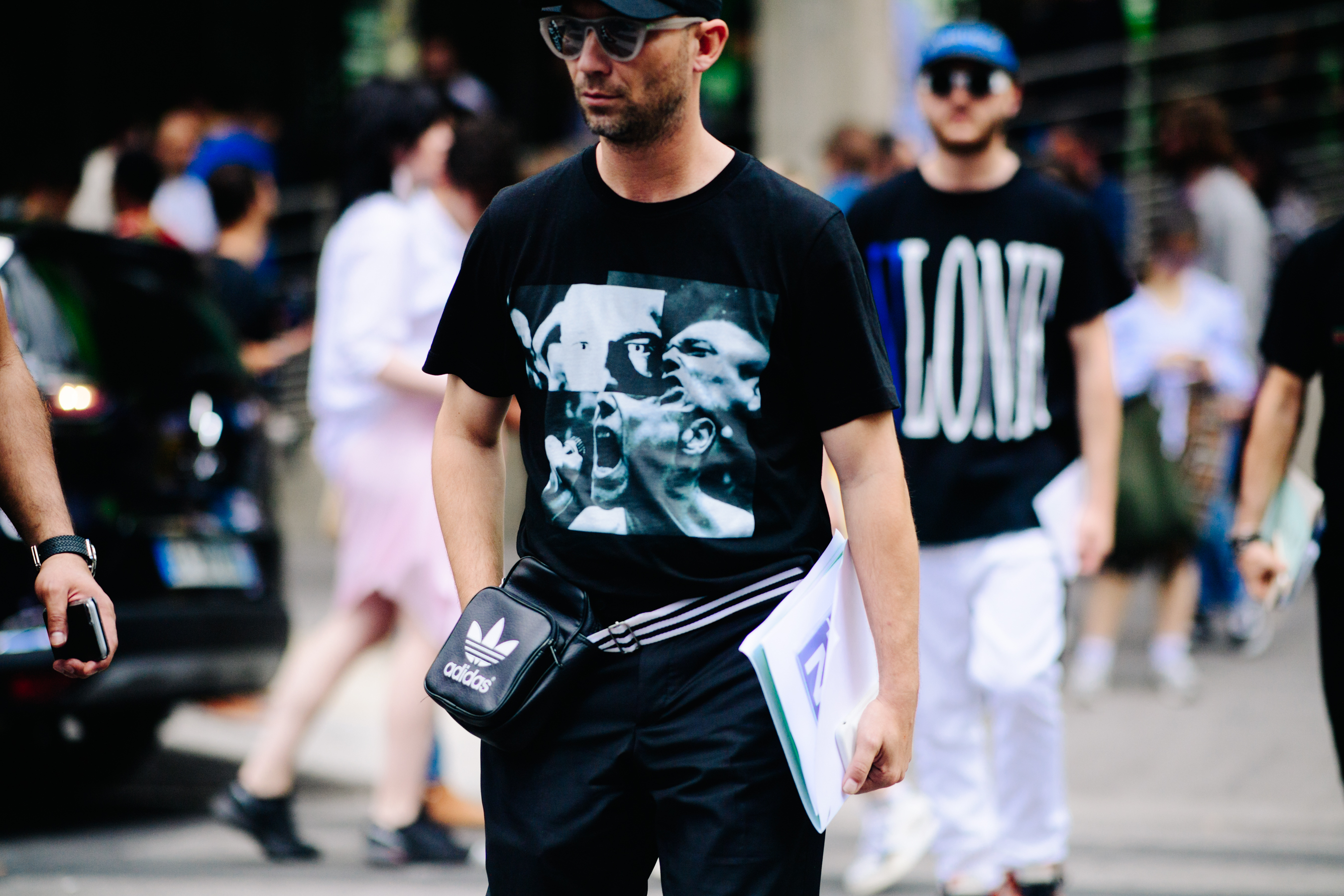 Man carrying an Adidas bag