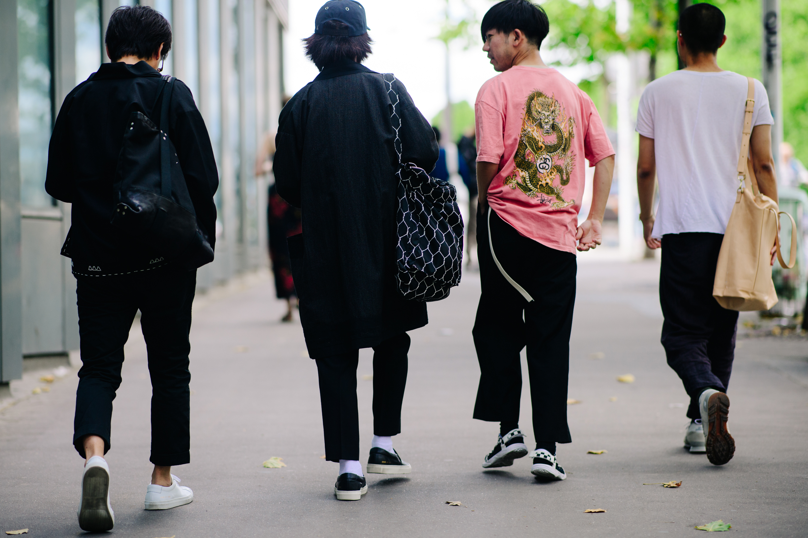Asian boy wearing New Balance sneakers