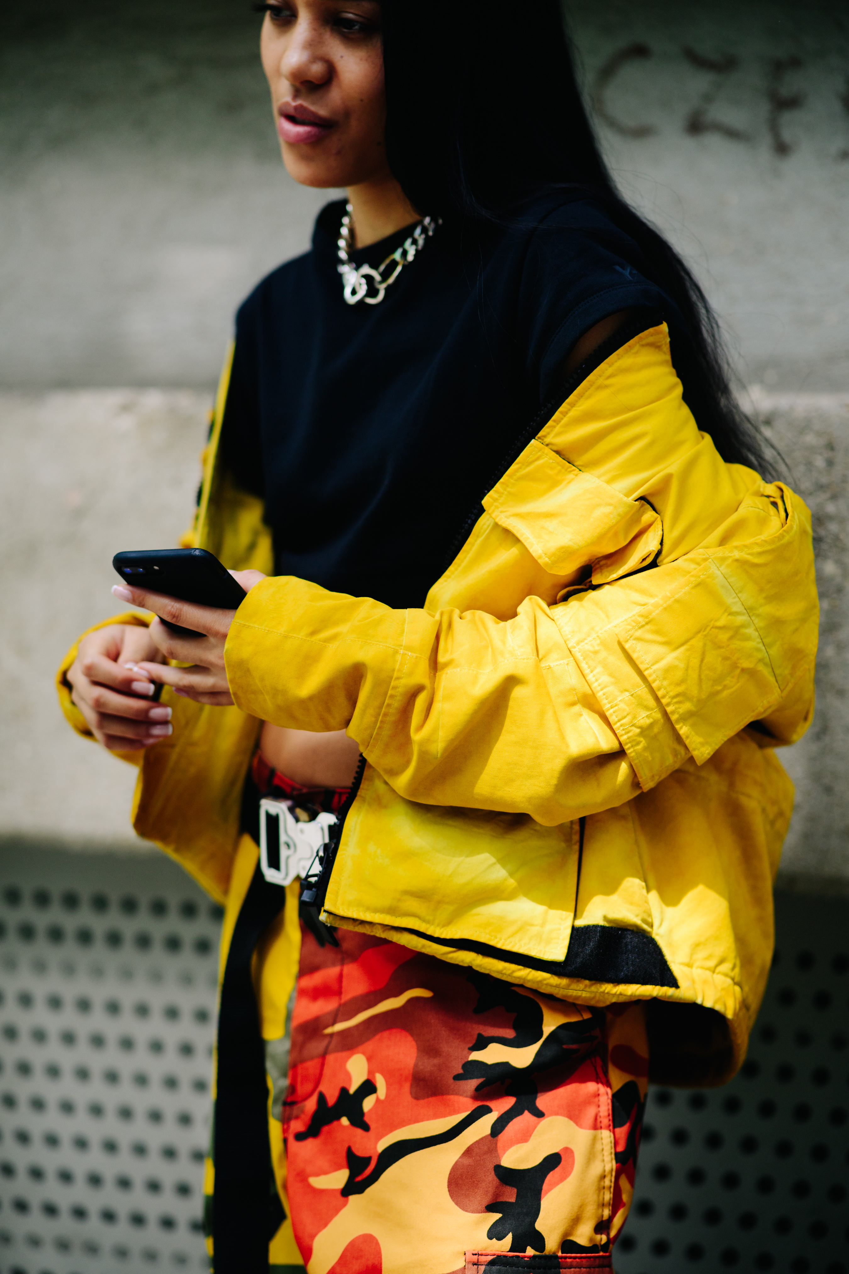 Woman wearing orange camo pants