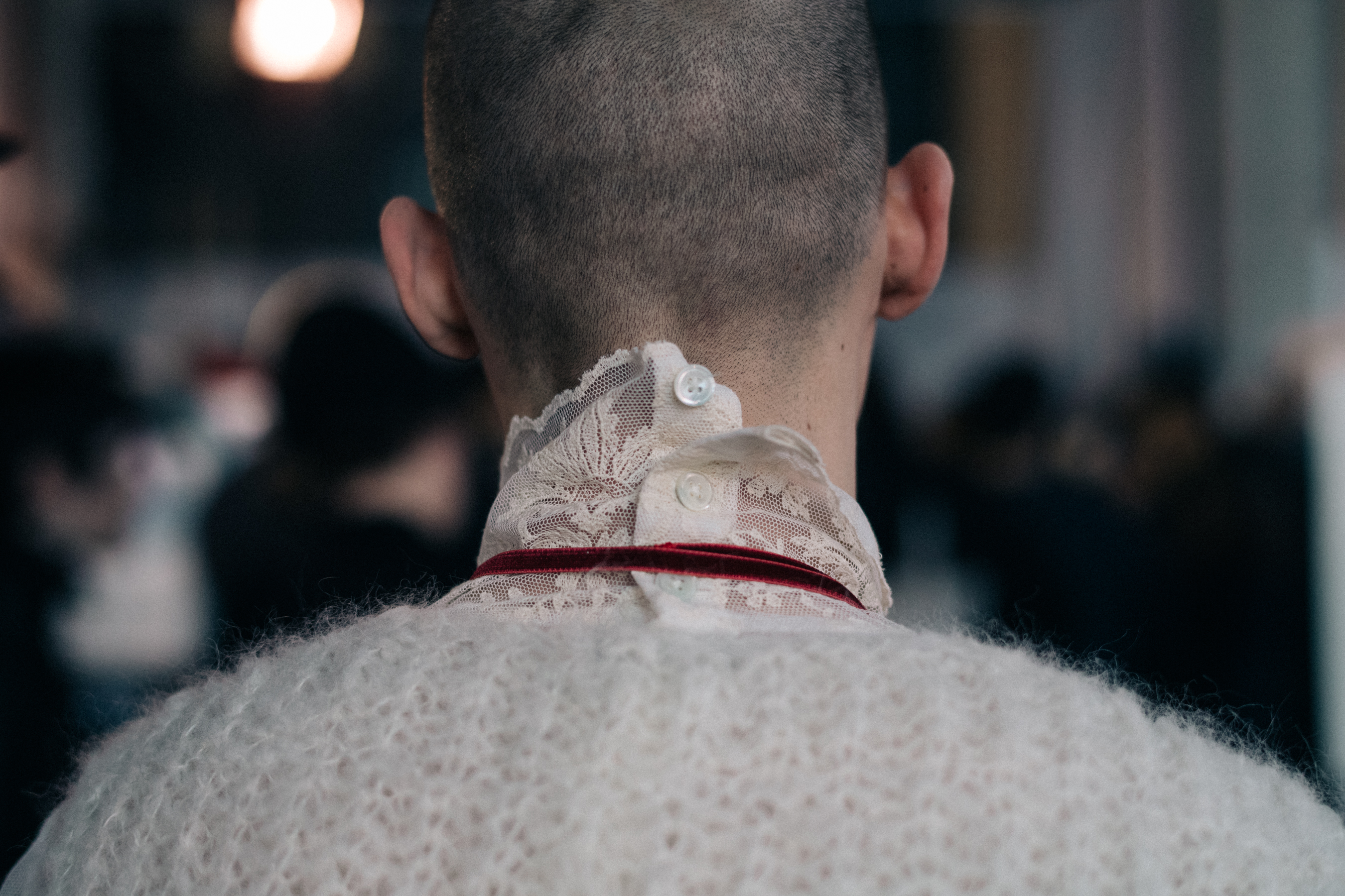 Male model wearing lace collar