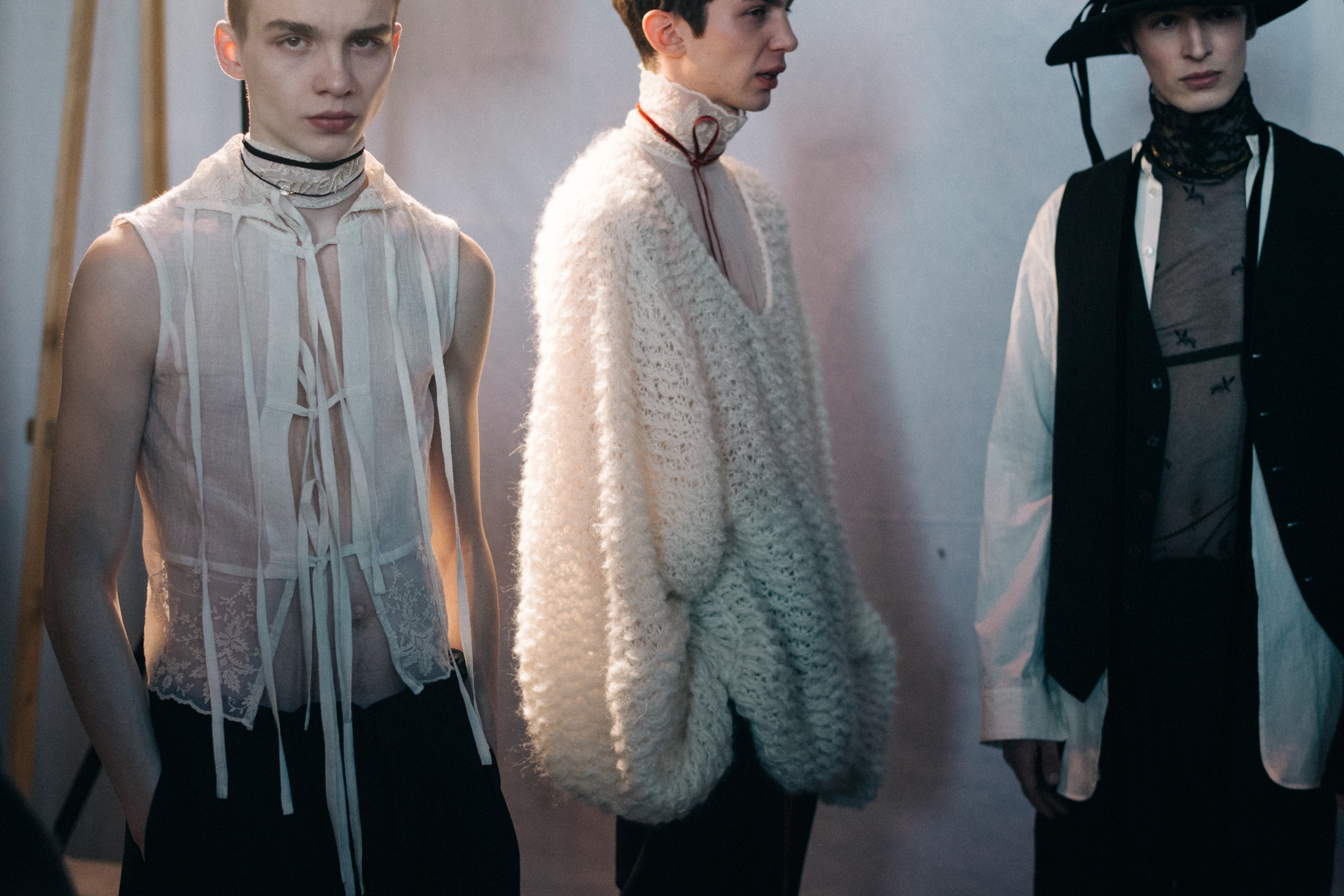 Group of male models before a show