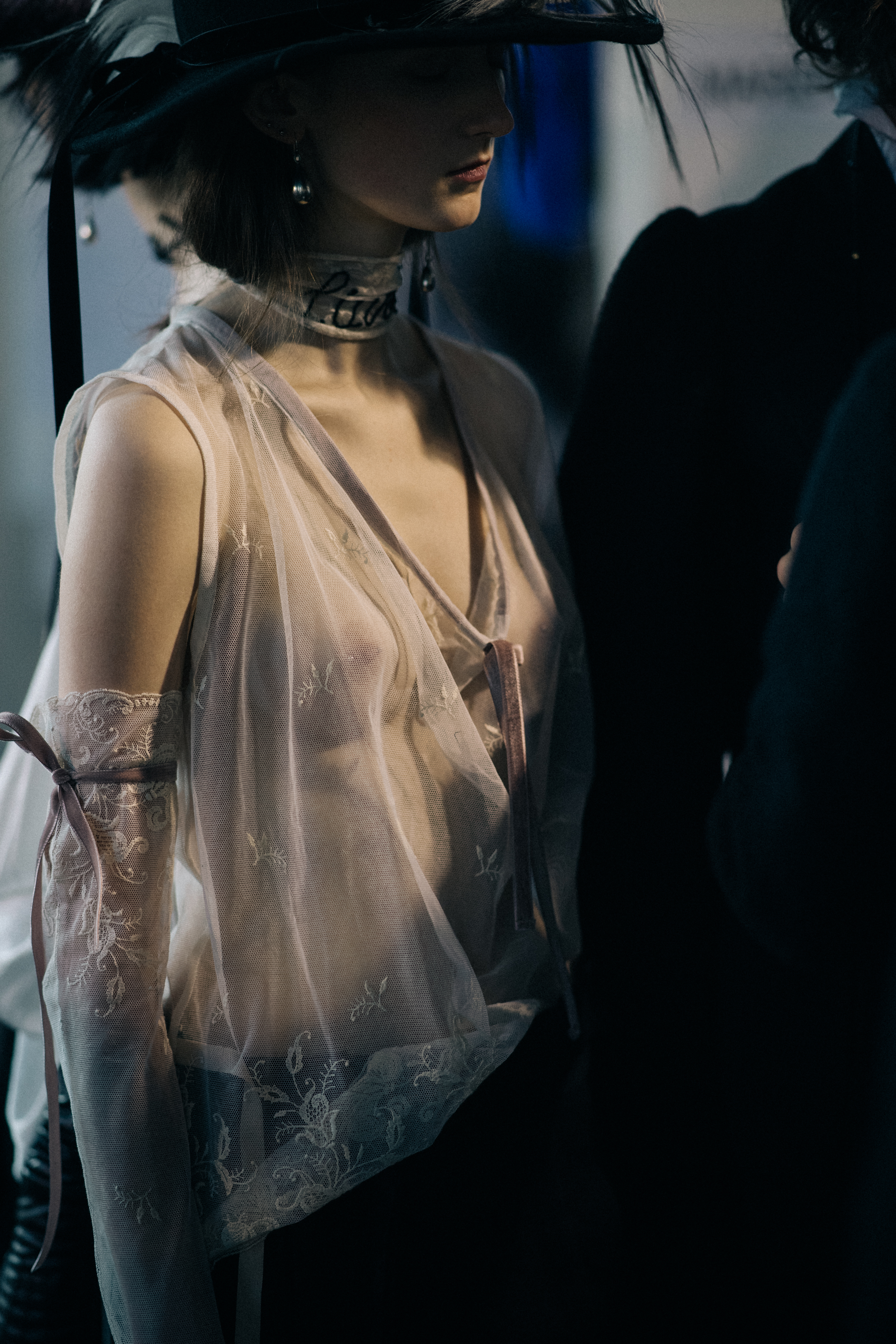 Model wearing lace gloves and top