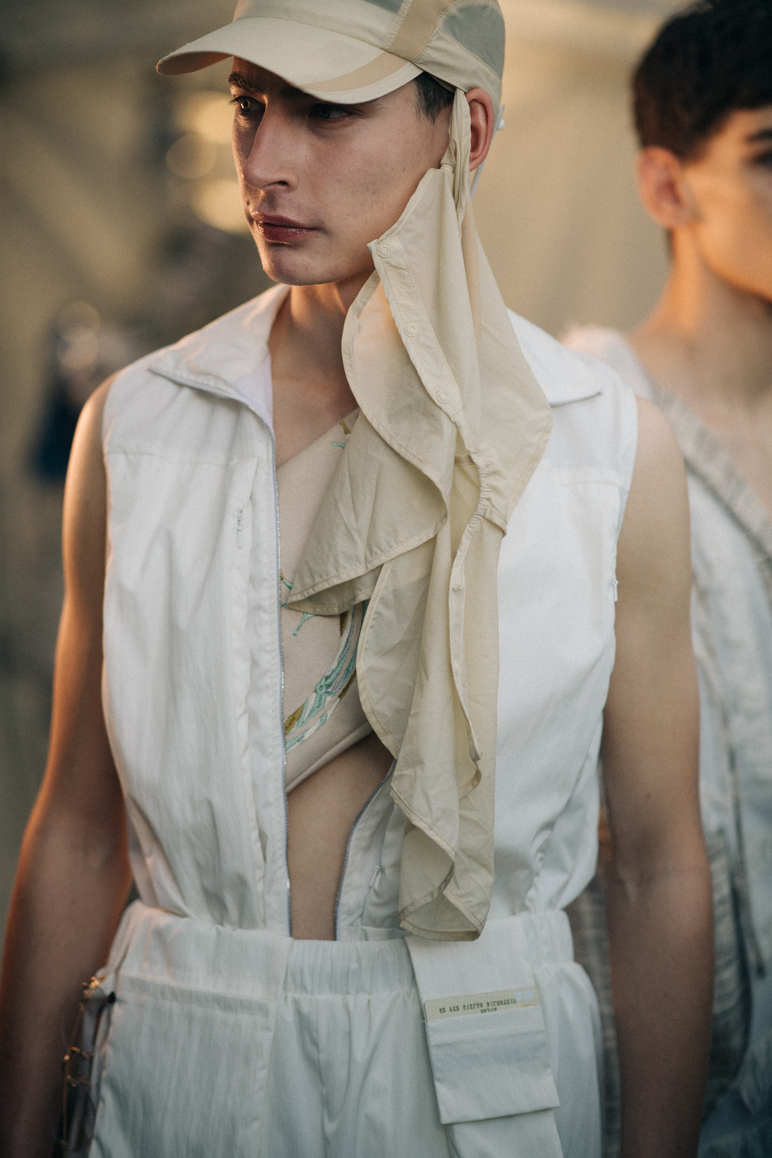 Male model wearing a beige cap