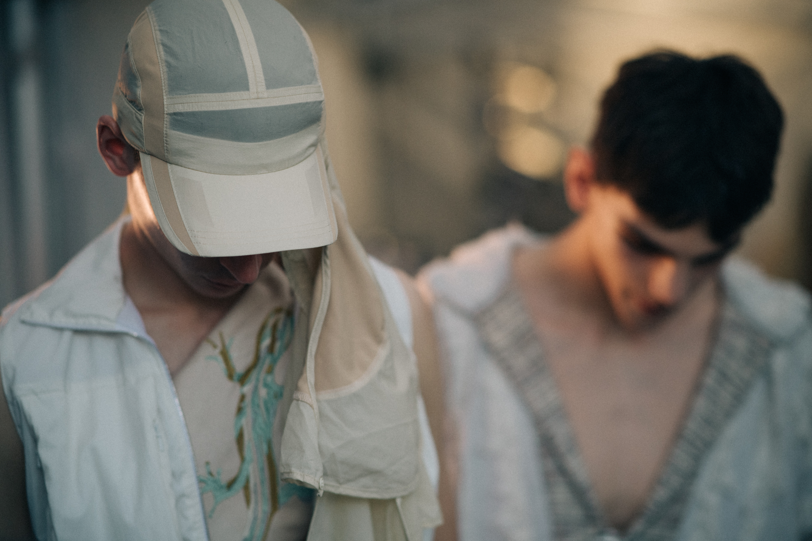 Male model wearing a beige cap
