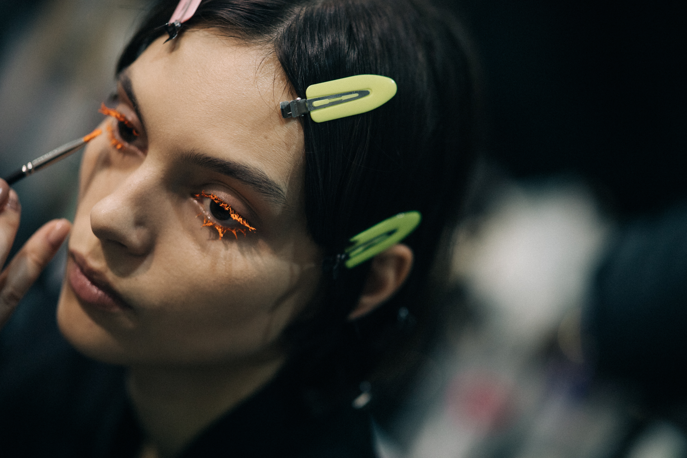 Model getting final make-up retouches