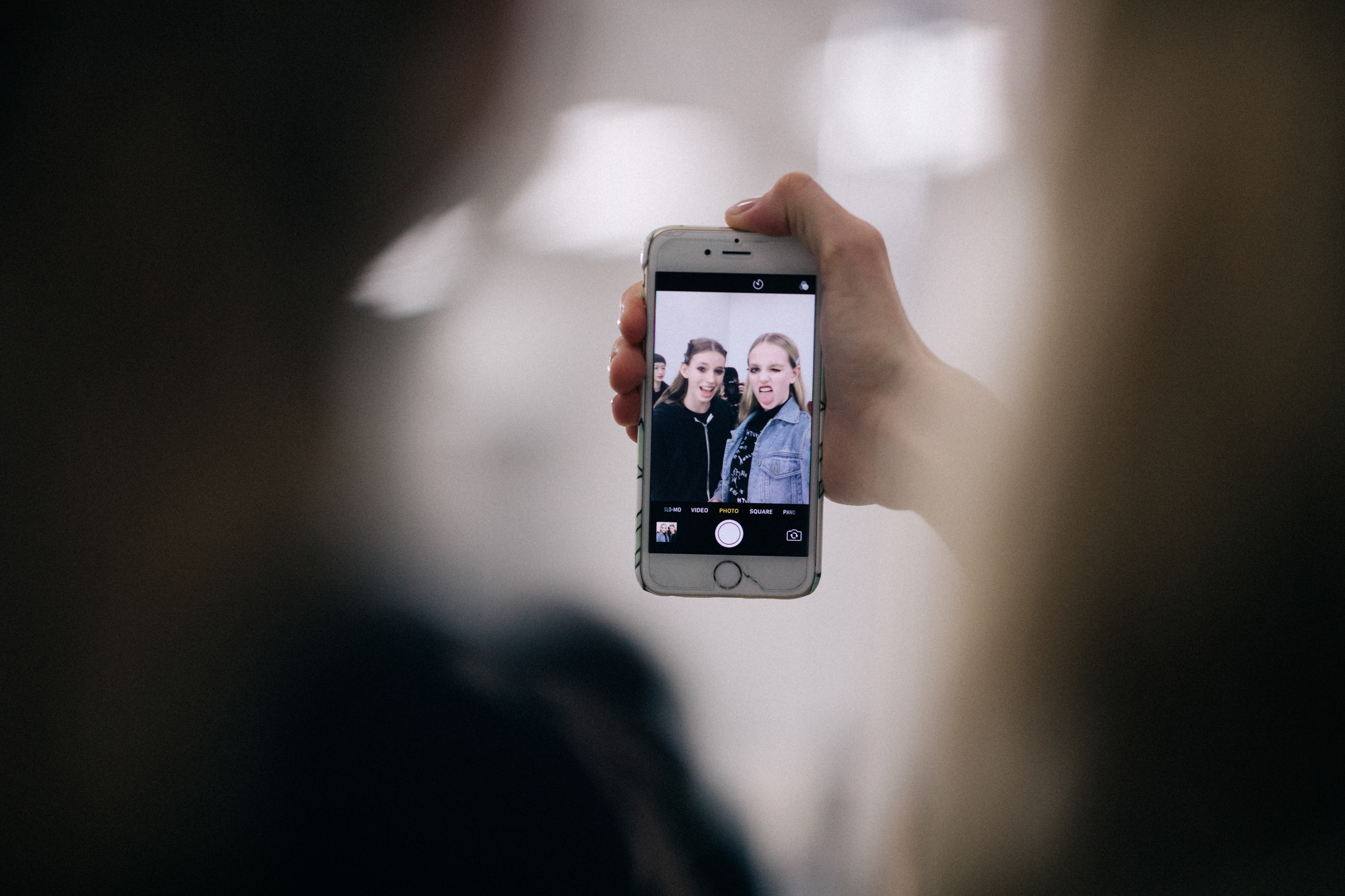 Models taking a selfie before runway