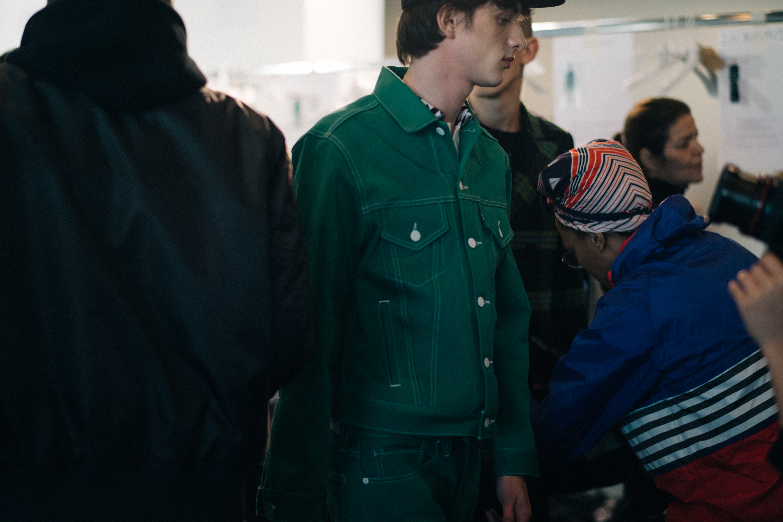 Male model wearing green denim
