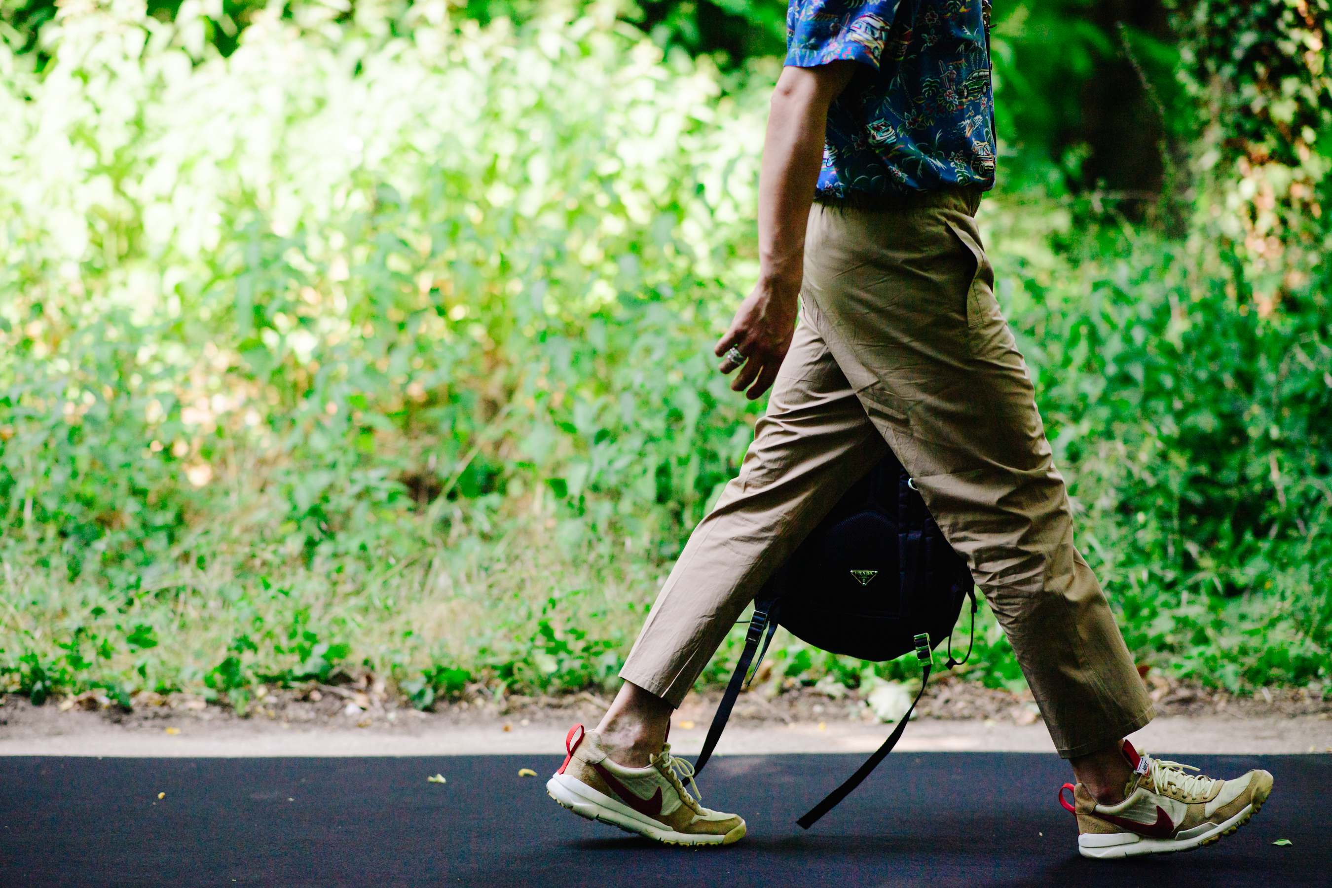Man wearing Prada and Nike sneakers