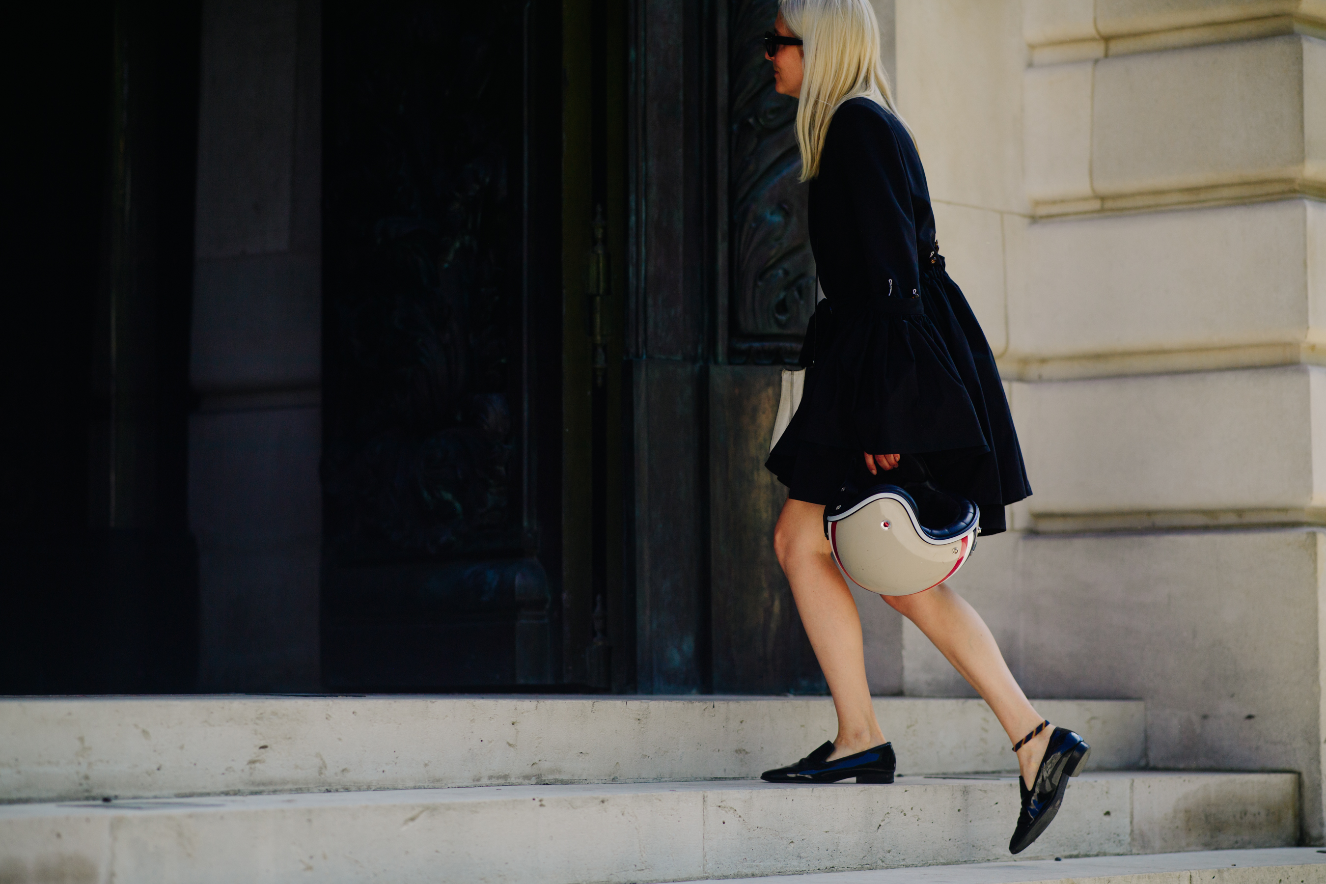 Woman wearing black leather shoes
