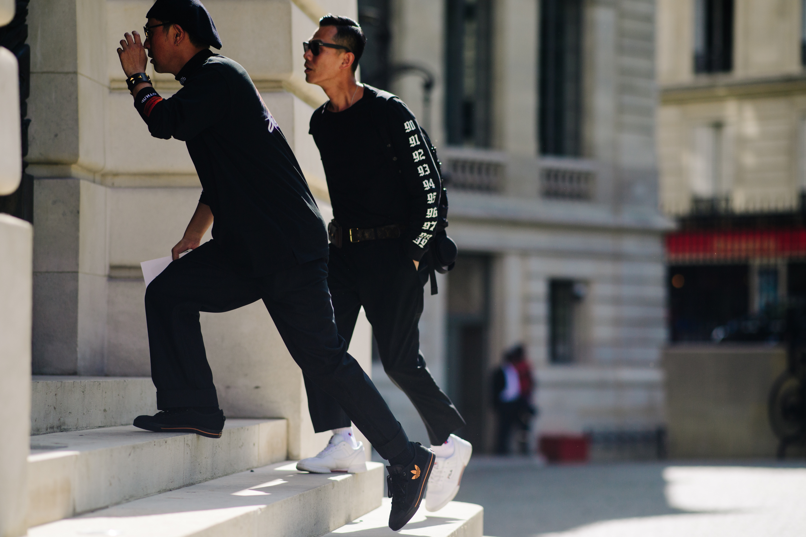 Men wearing Fila and Adidas sneakers