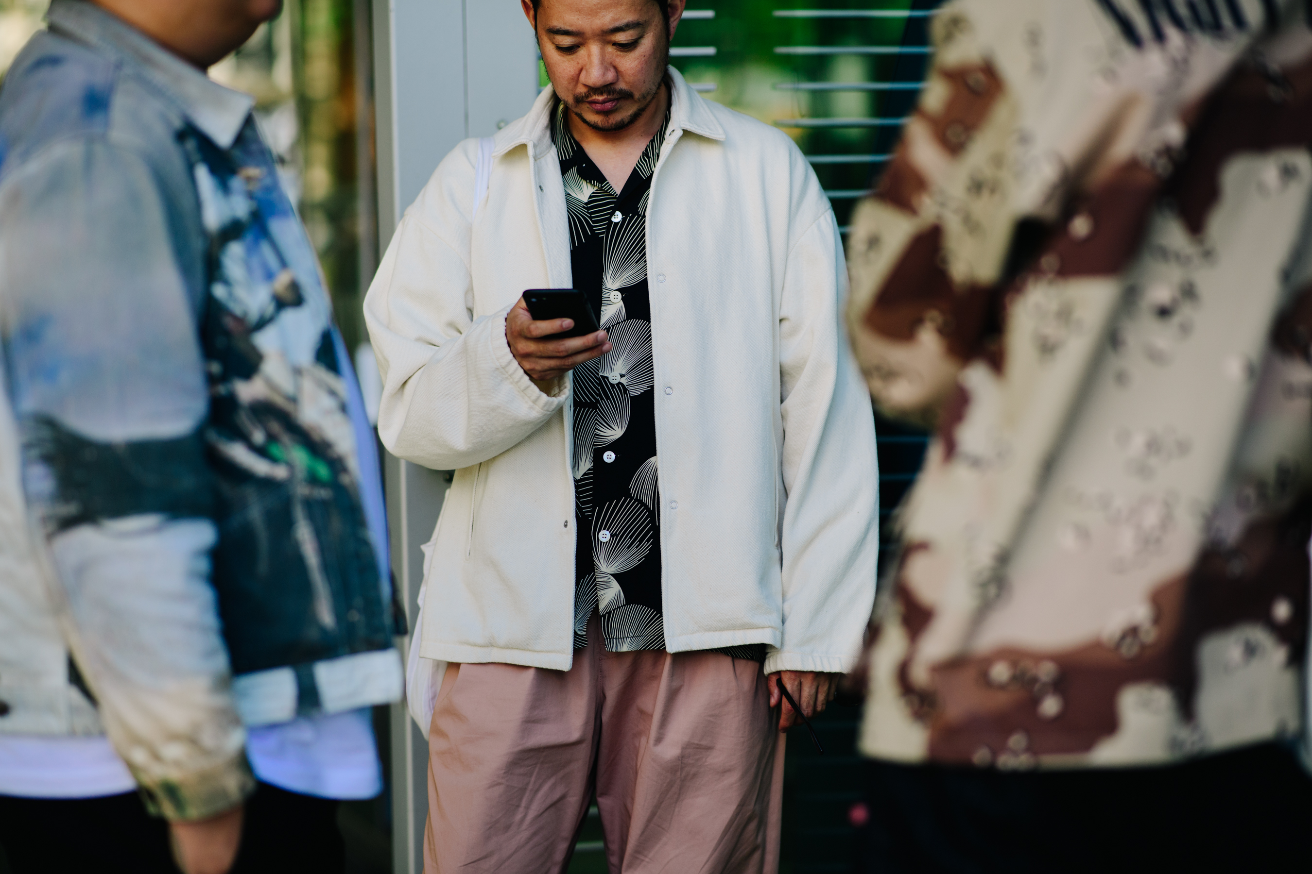 Man wearing a large white jacket