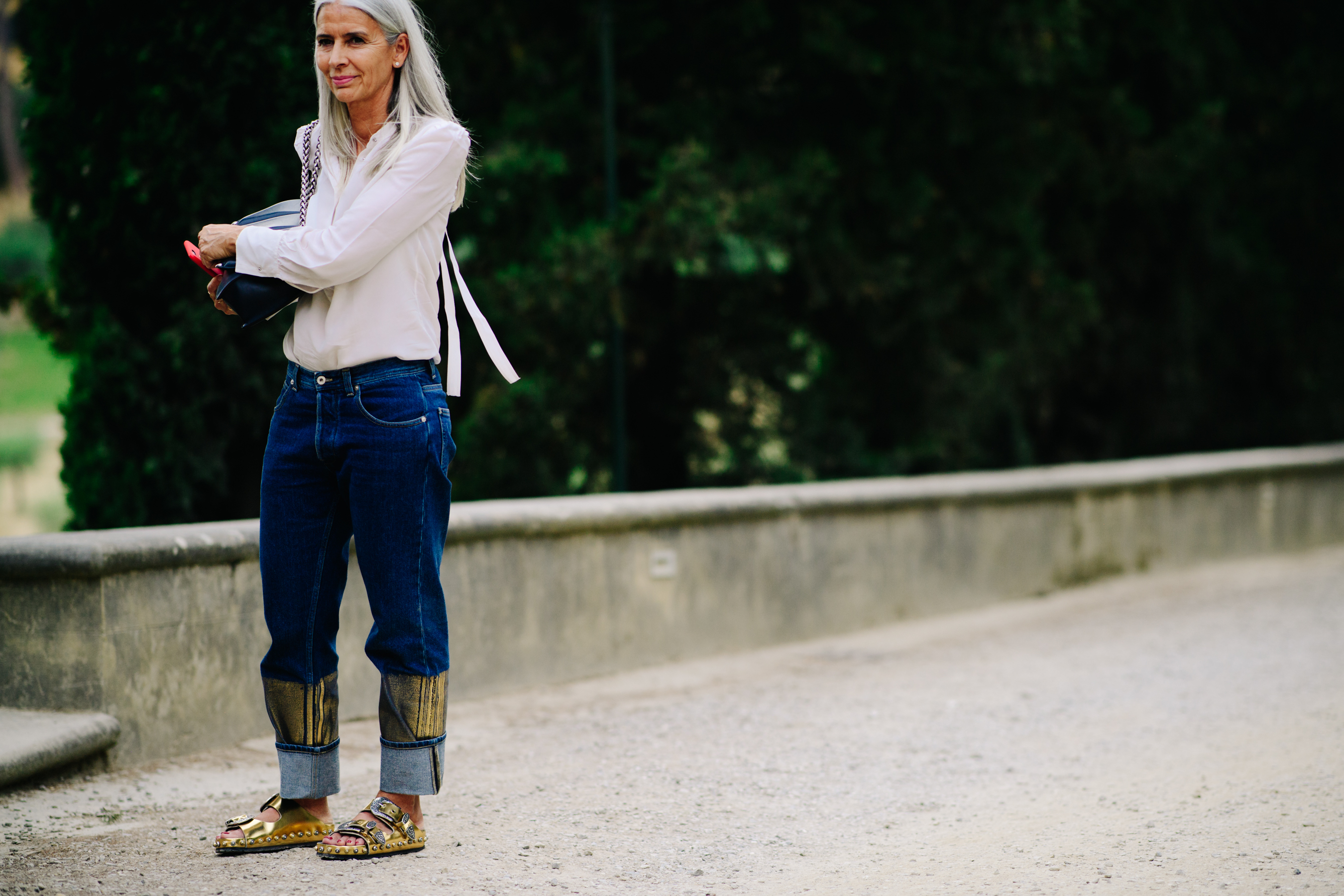 Woman wearing golden sandals