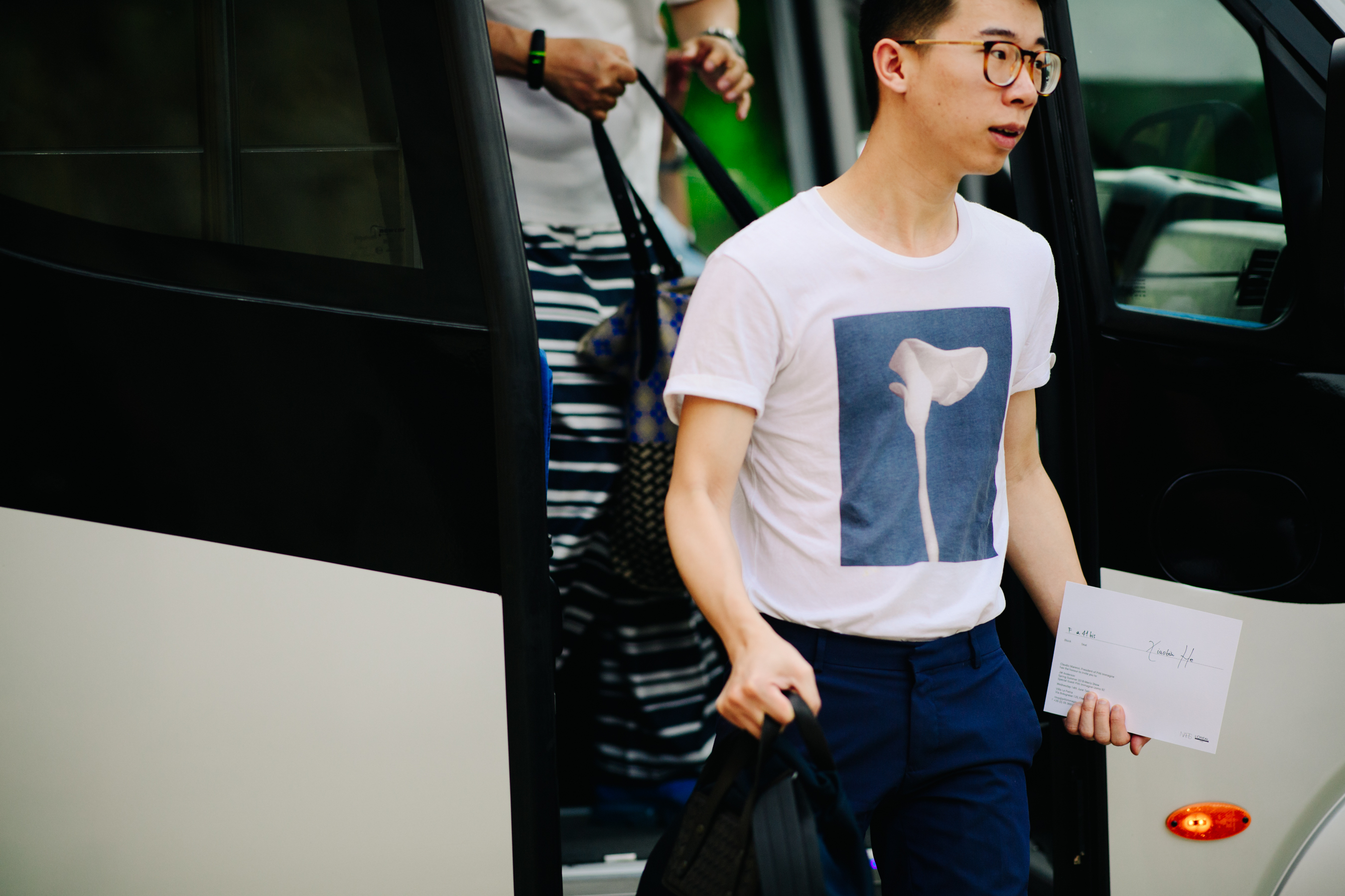Asian boy stepping out a shuttle