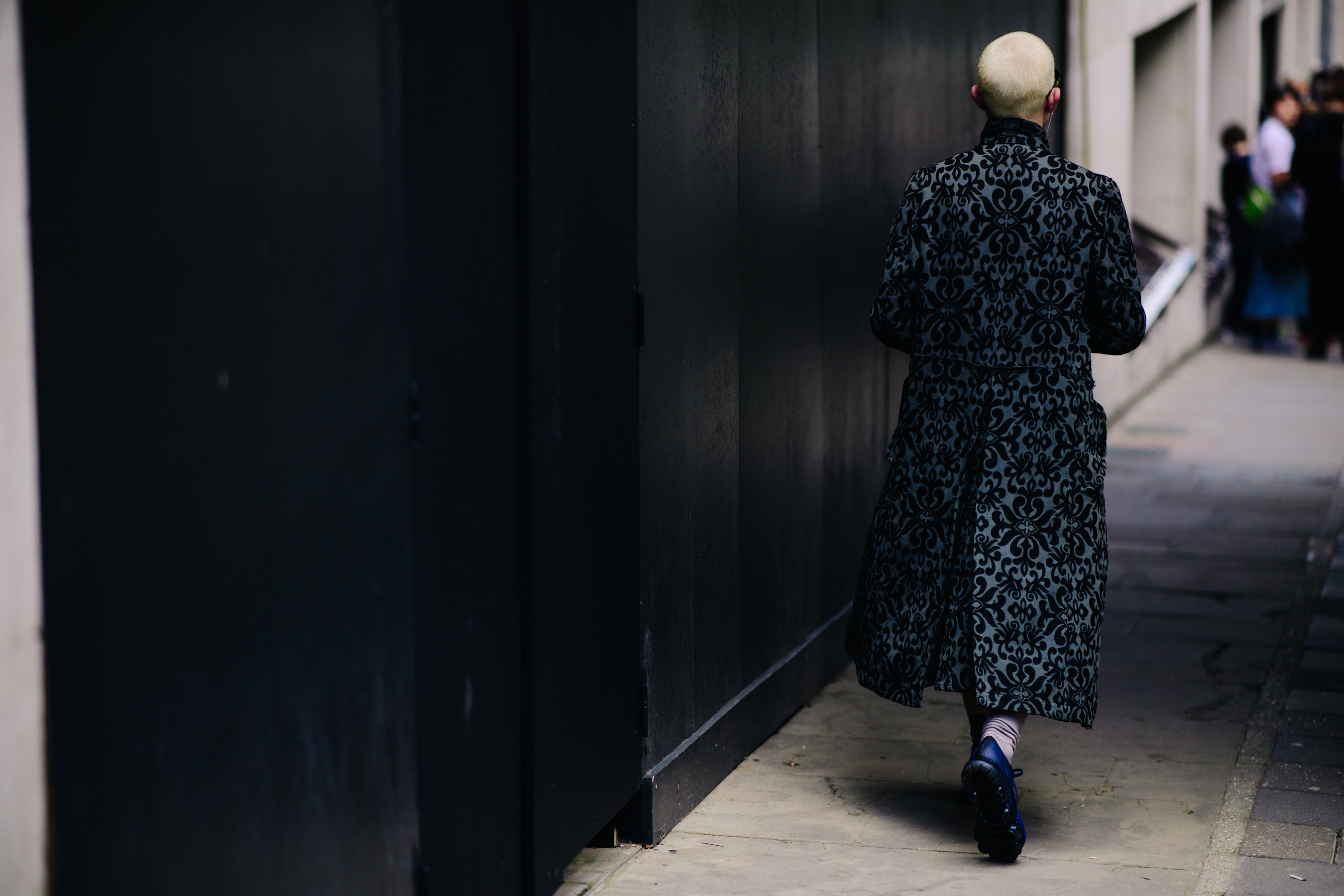 Man wearing long pattern coat
