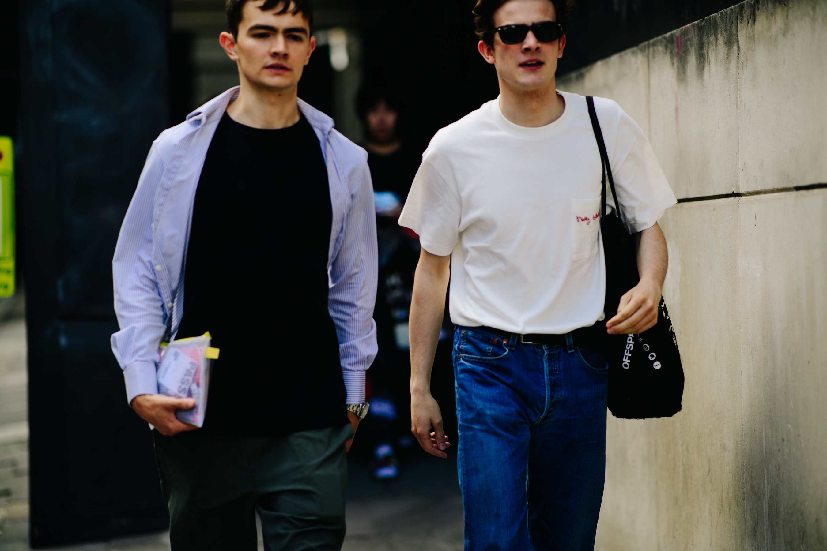 Two boys walking on the street