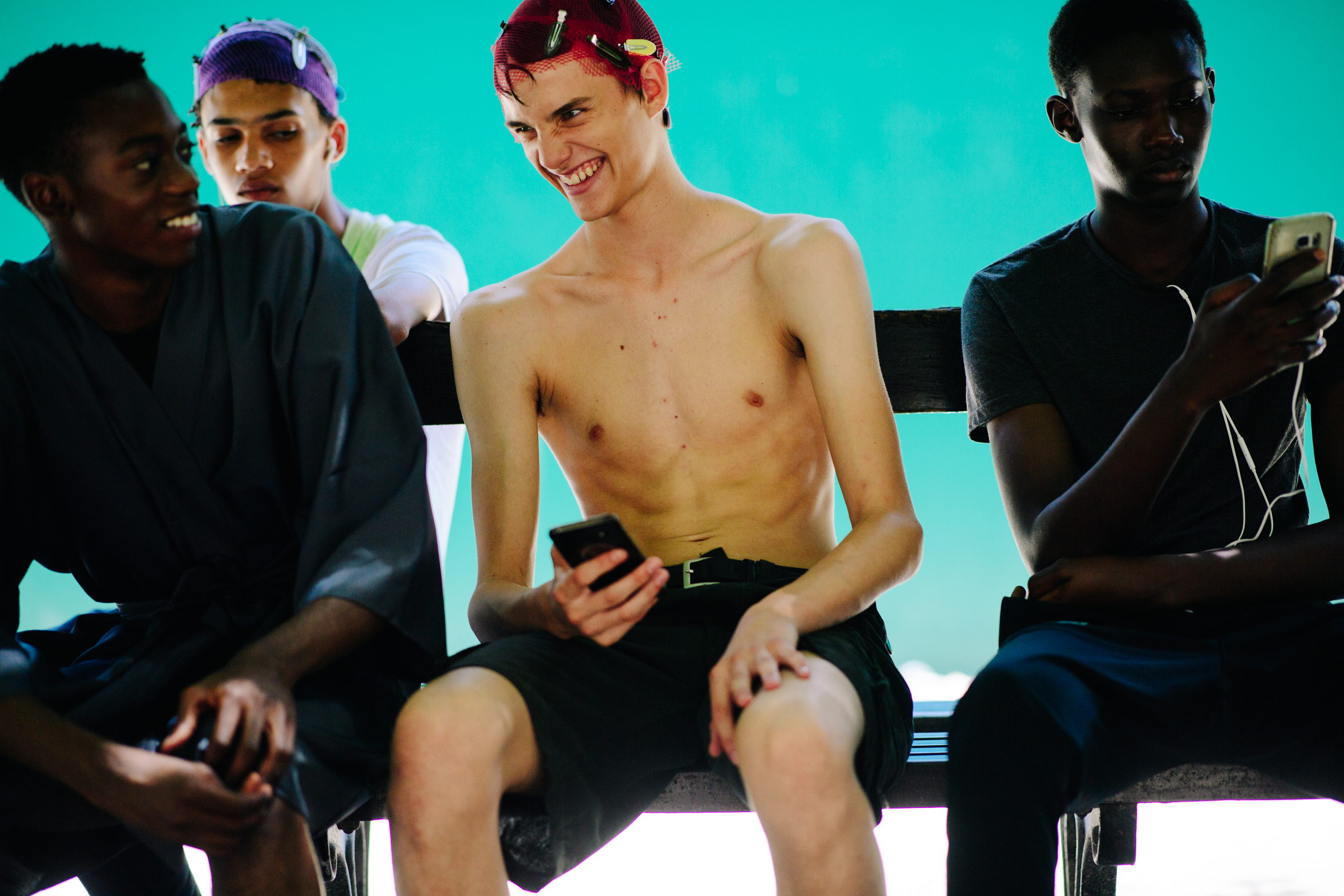 Male models hanging at Louis Vuitton