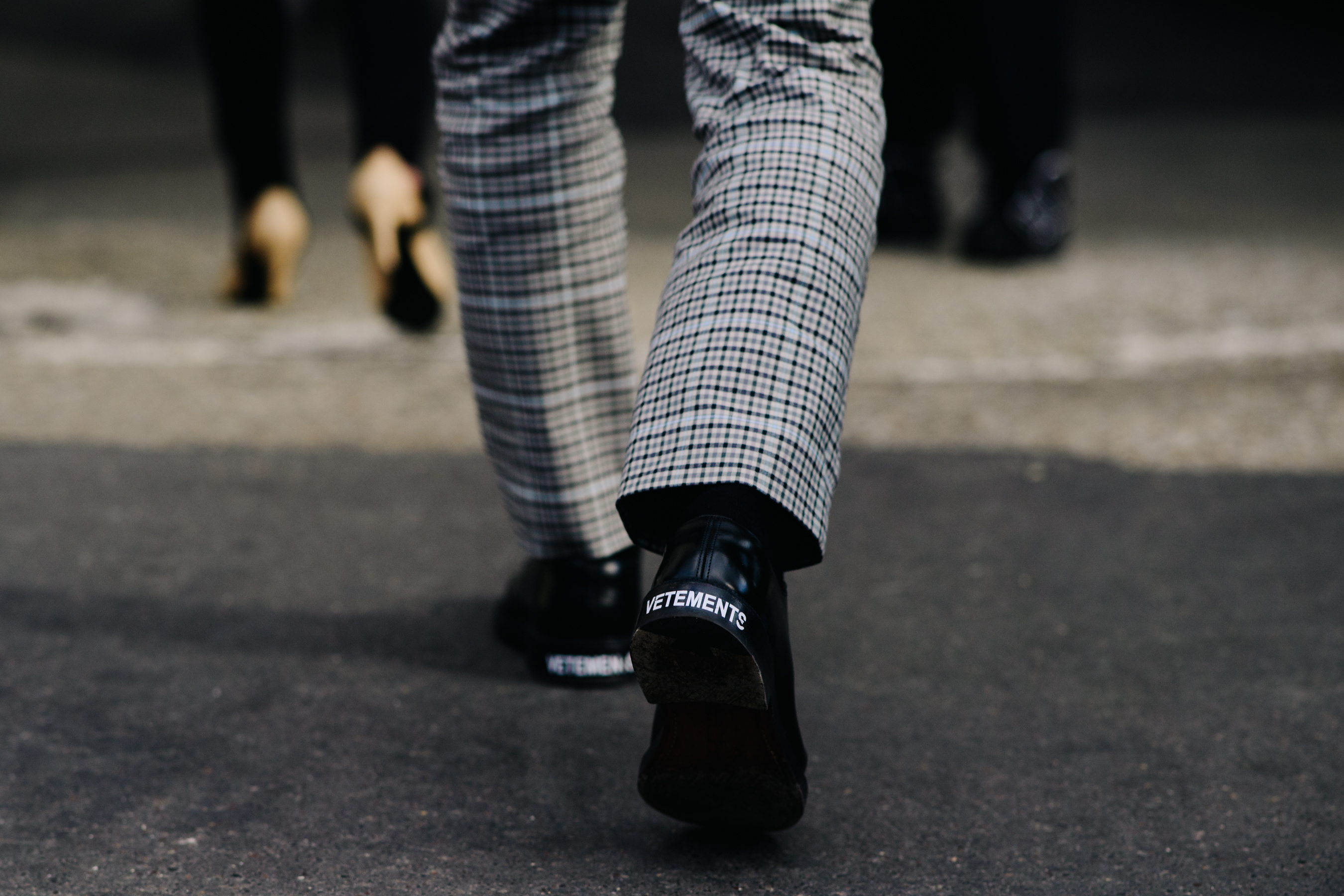 Man wearing Vetements black shoes