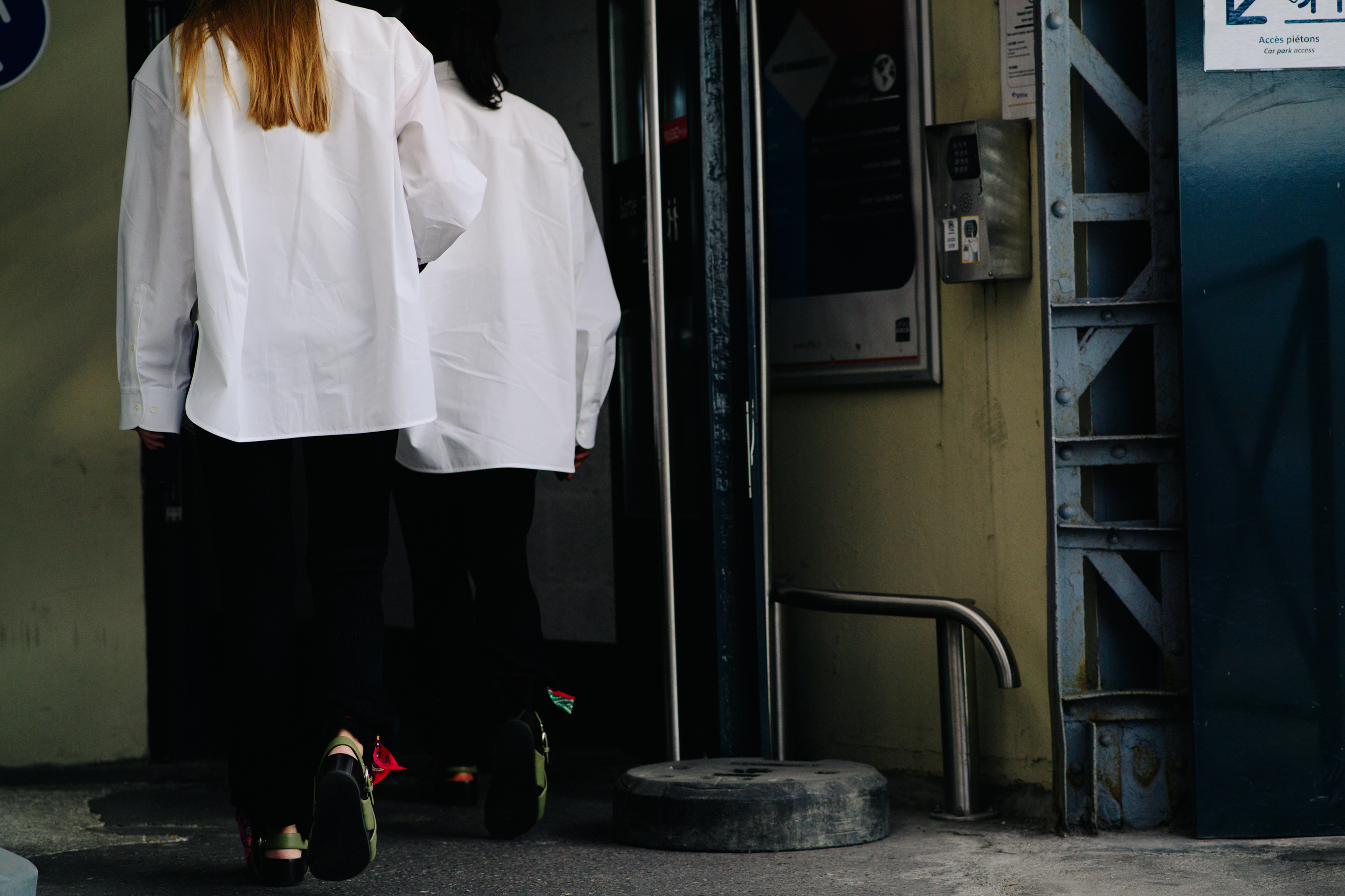 Two girls wearing white shirts