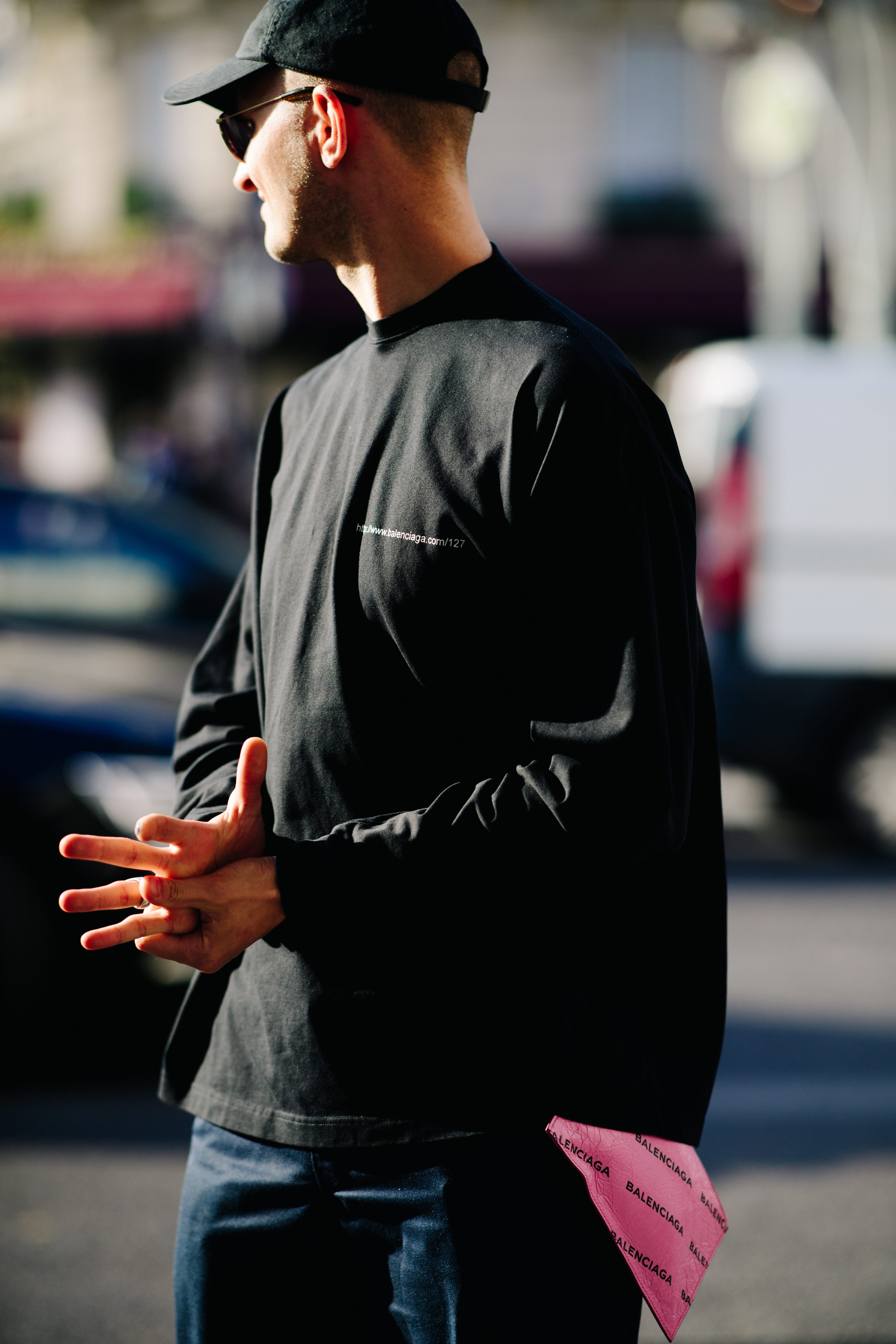 Man carrying a Balenciaga wallet