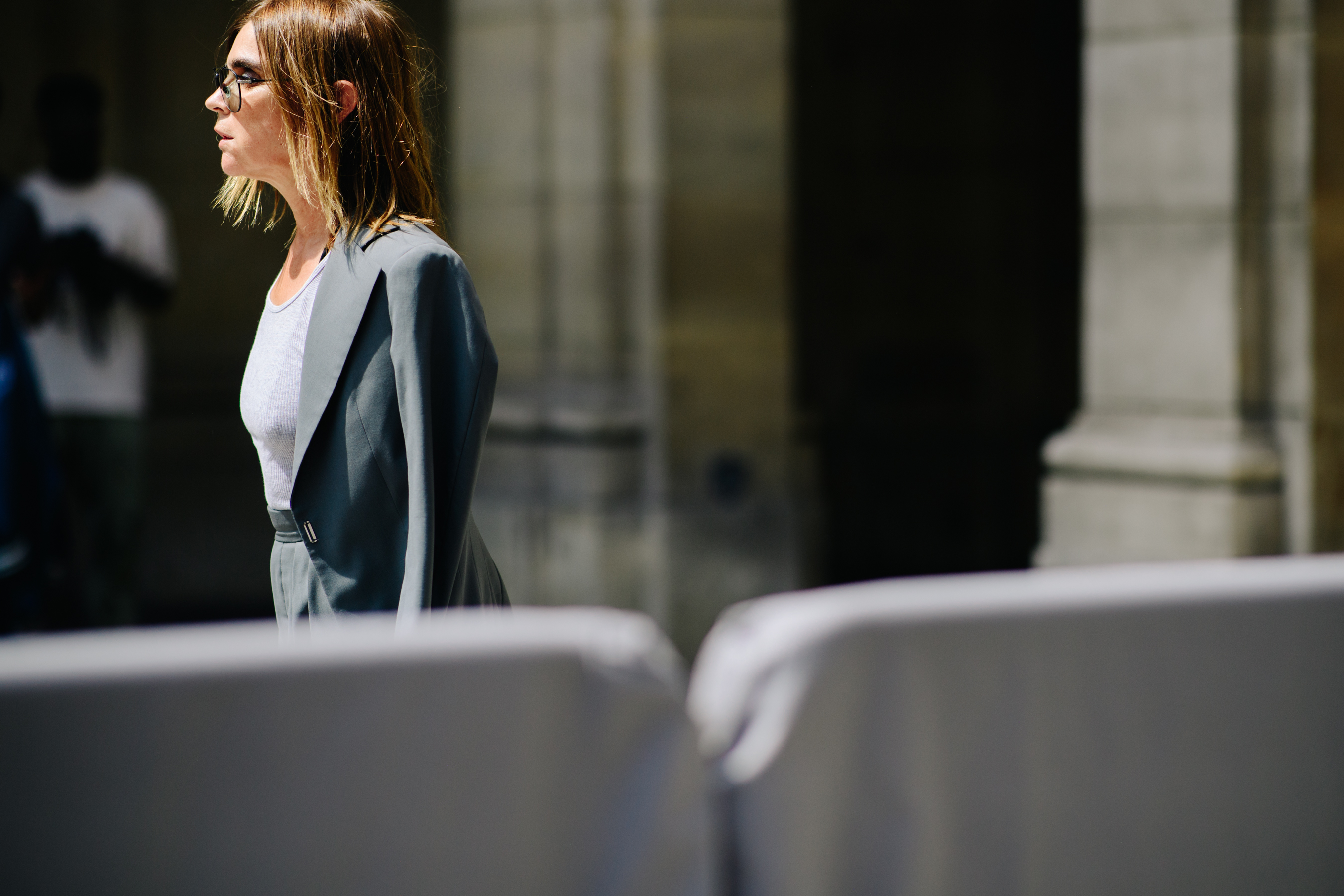 Carine Roitfeld wearing a grey jacket