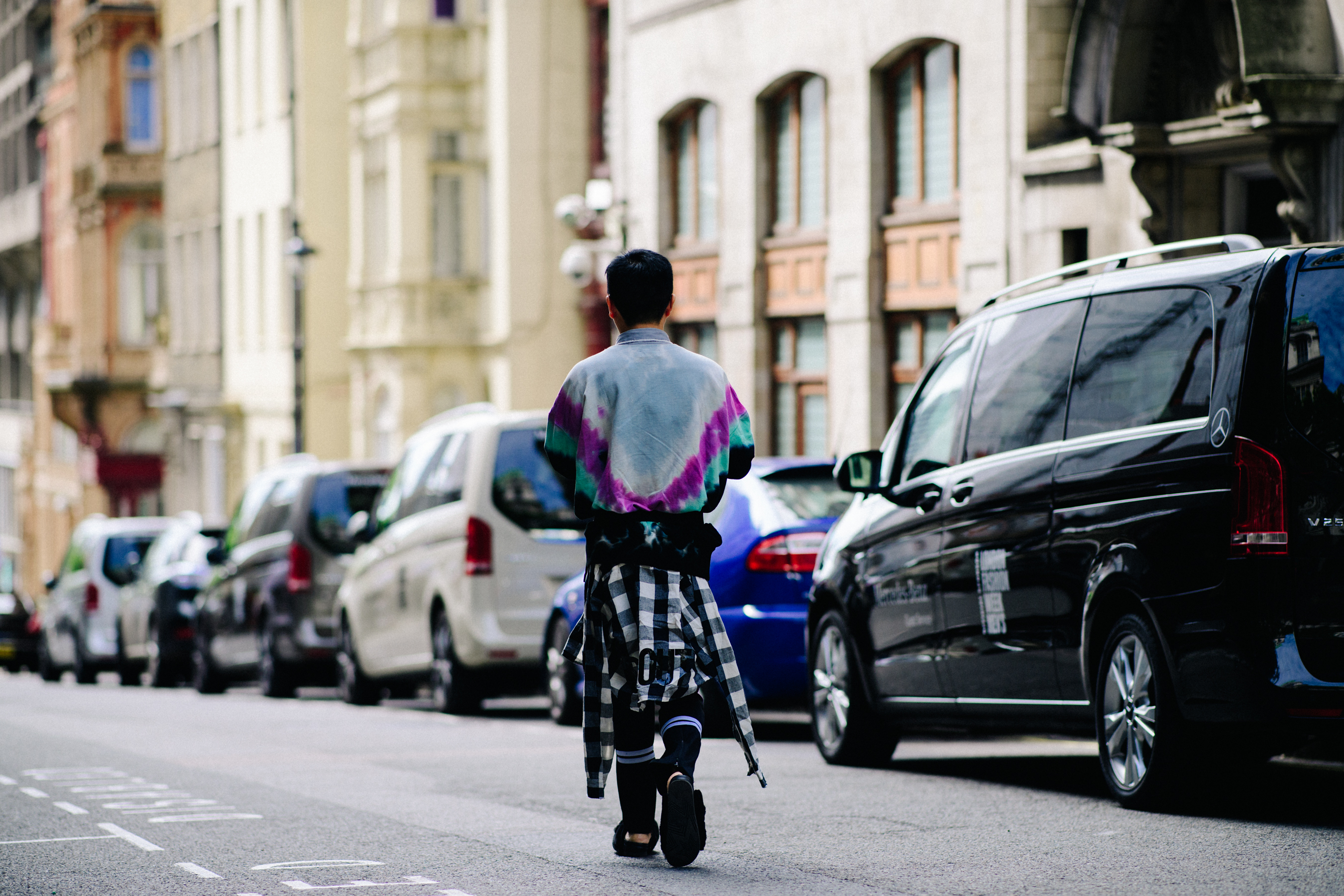 Asian boy wearing a checkered shirt