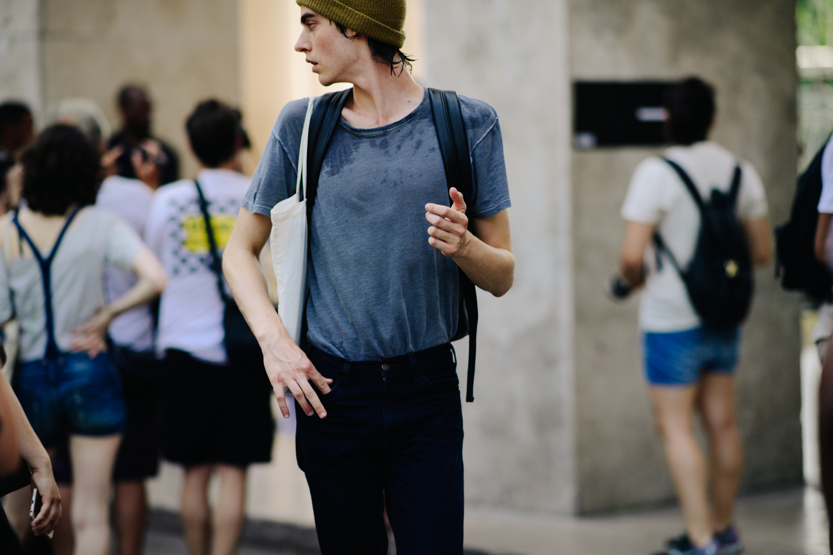Male model wearing a grey t-shirt