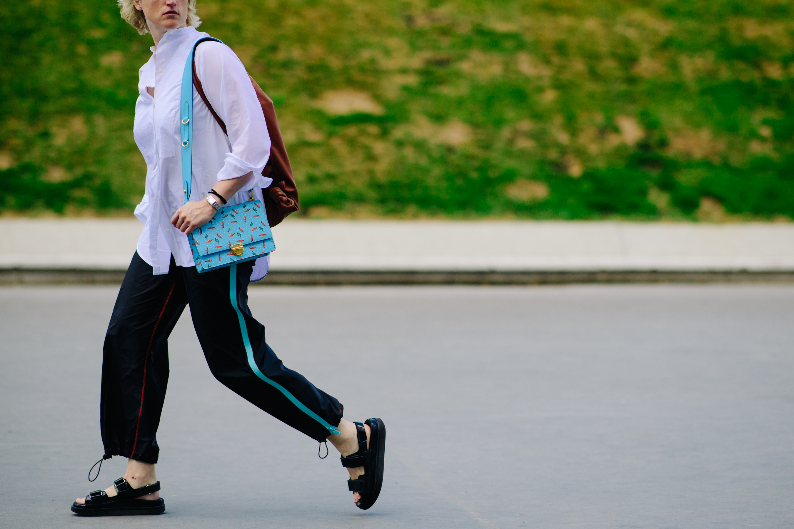 Woman carrying a light blue bag
