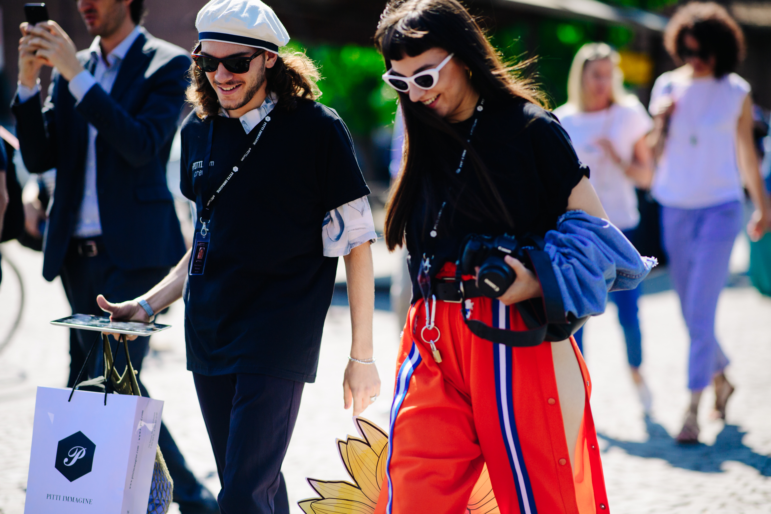 Man and woman wearing black t-shirts