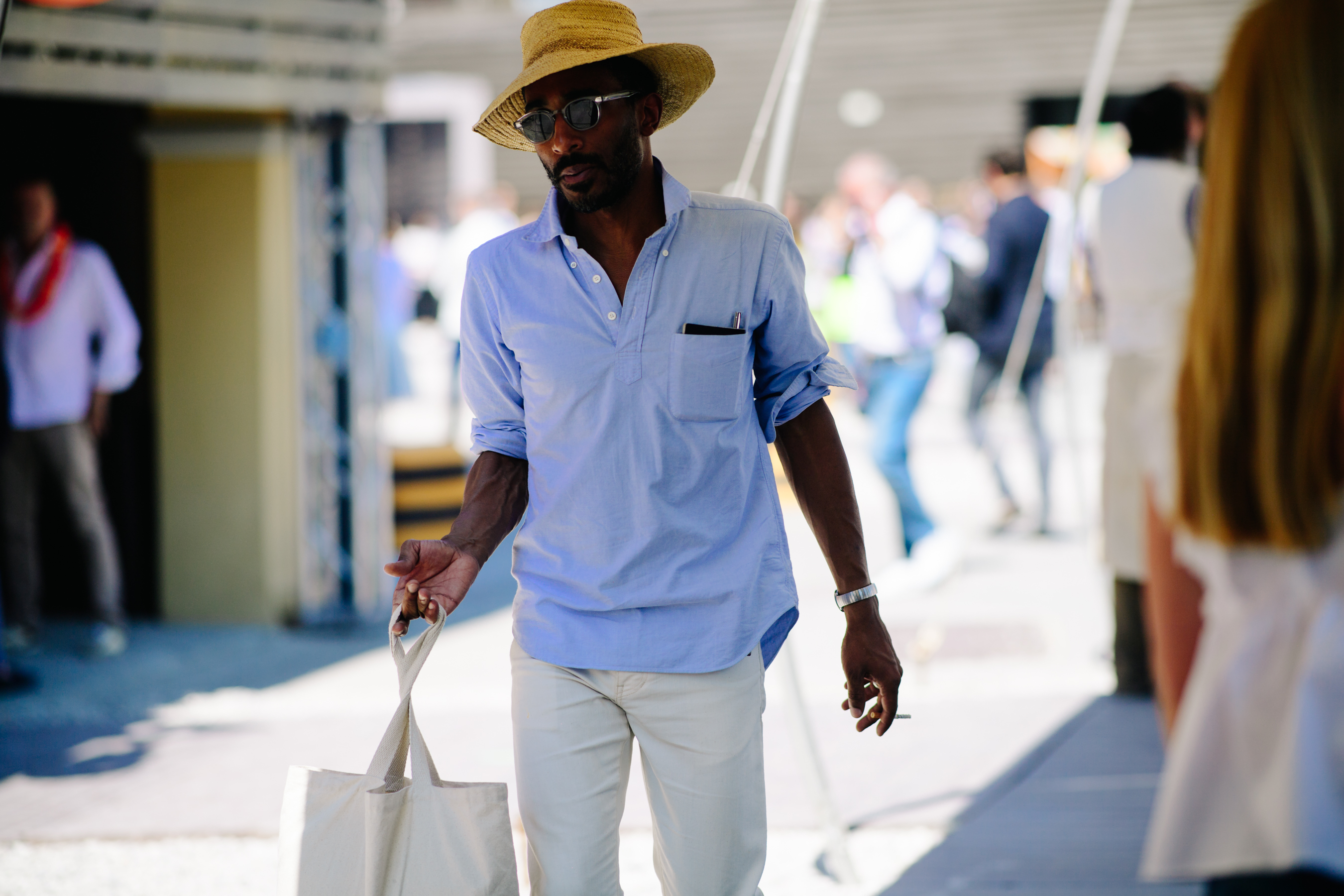 Man wearing blue shirt and hat